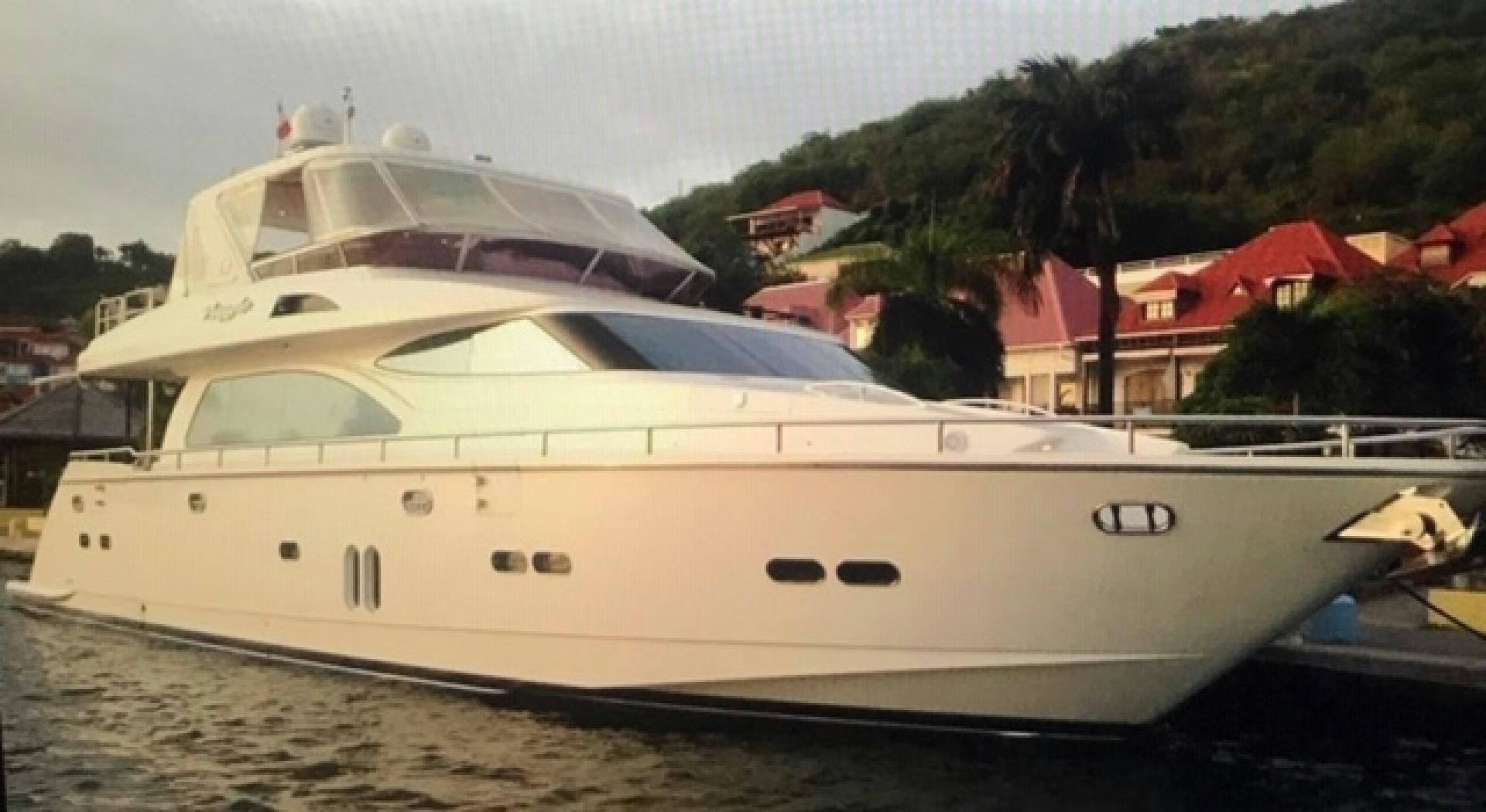 a white yacht on a beach aboard VIAGGIO Yacht for Sale
