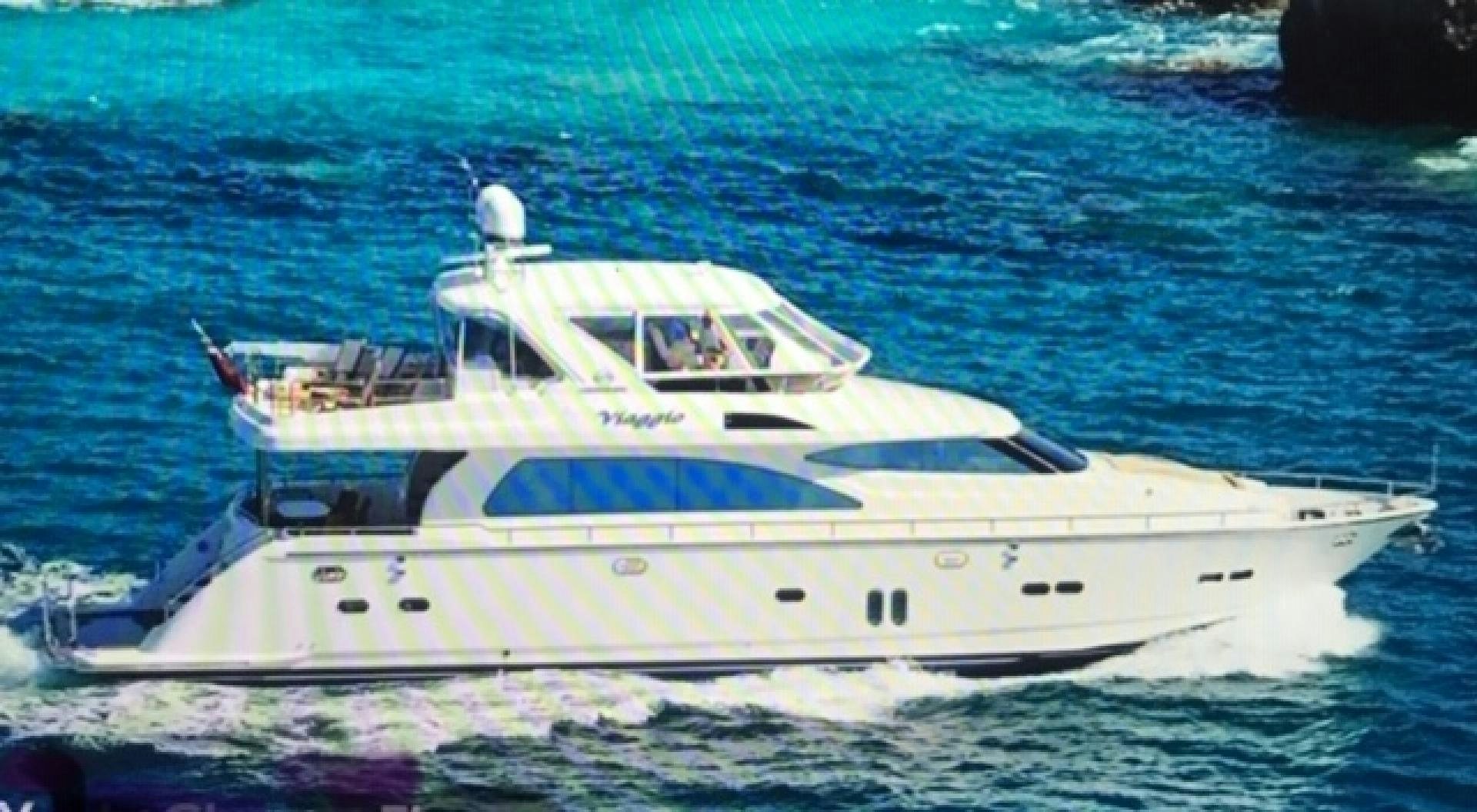 a white boat in the water aboard VIAGGIO Yacht for Sale