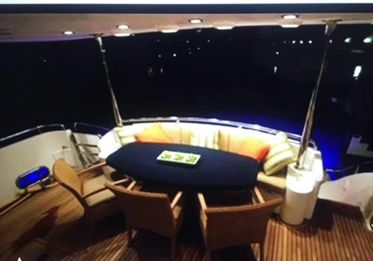 a car with a surfboard on the back aboard VIAGGIO Yacht for Sale