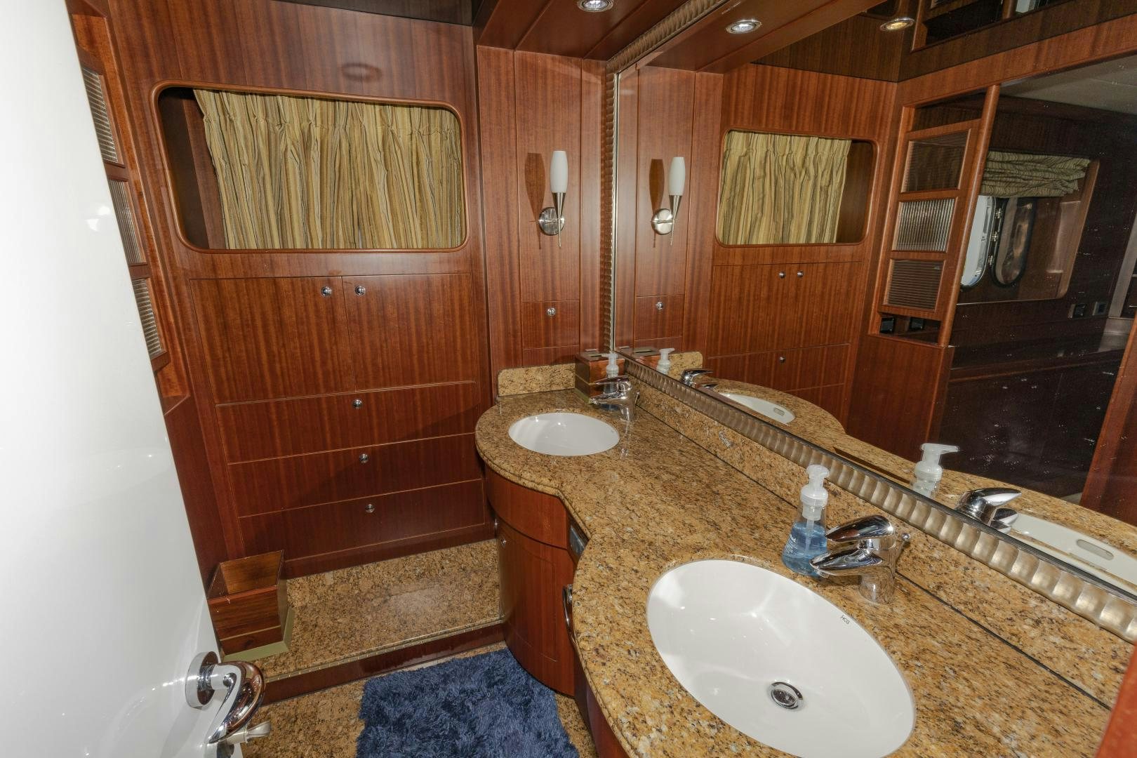 a bathroom with two sinks aboard VIAGGIO Yacht for Sale