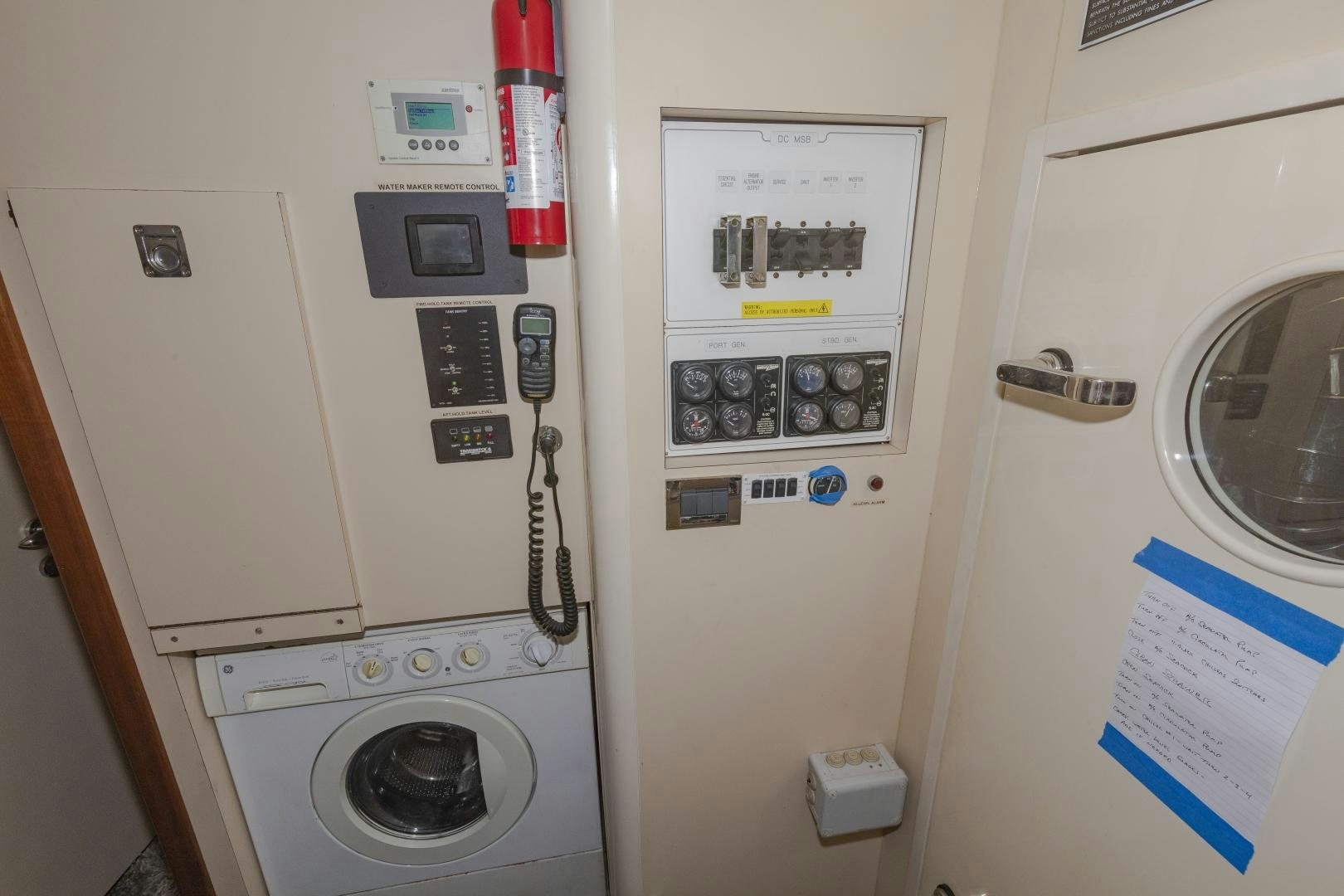 a white machine with buttons and a telephone on it aboard VIAGGIO Yacht for Sale
