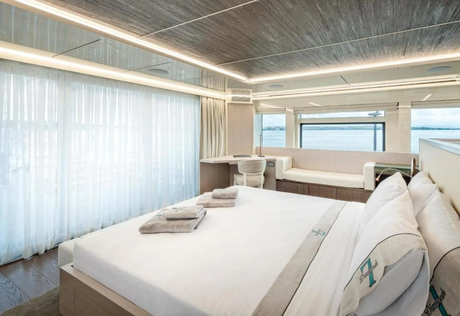 a room with a bed and a window aboard ZARANIA Yacht for Sale