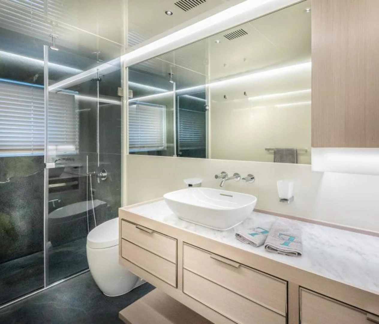 a bathroom with a glass shower aboard ZARANIA Yacht for Sale