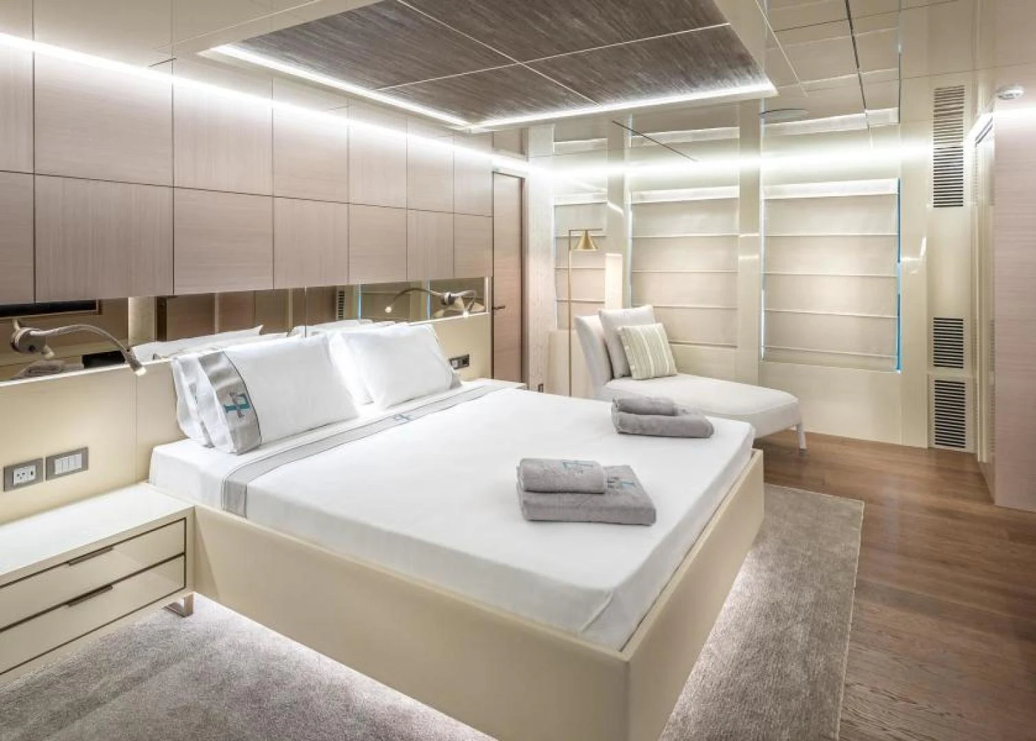 a room with a bed and a couch aboard ZARANIA Yacht for Sale