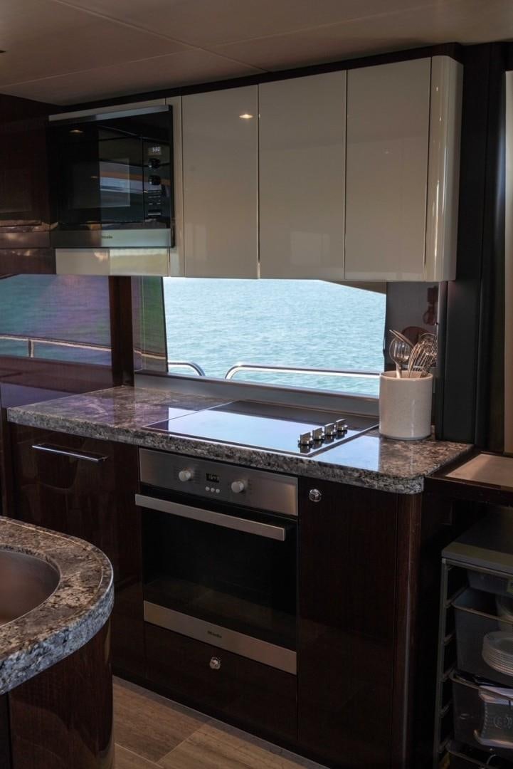 a kitchen with a large window aboard ENTERPRISE Yacht for Sale
