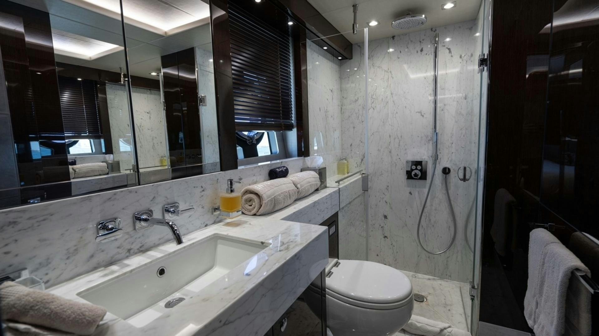 a bathroom with a sink toilet and a shower aboard ENTERPRISE Yacht for Sale