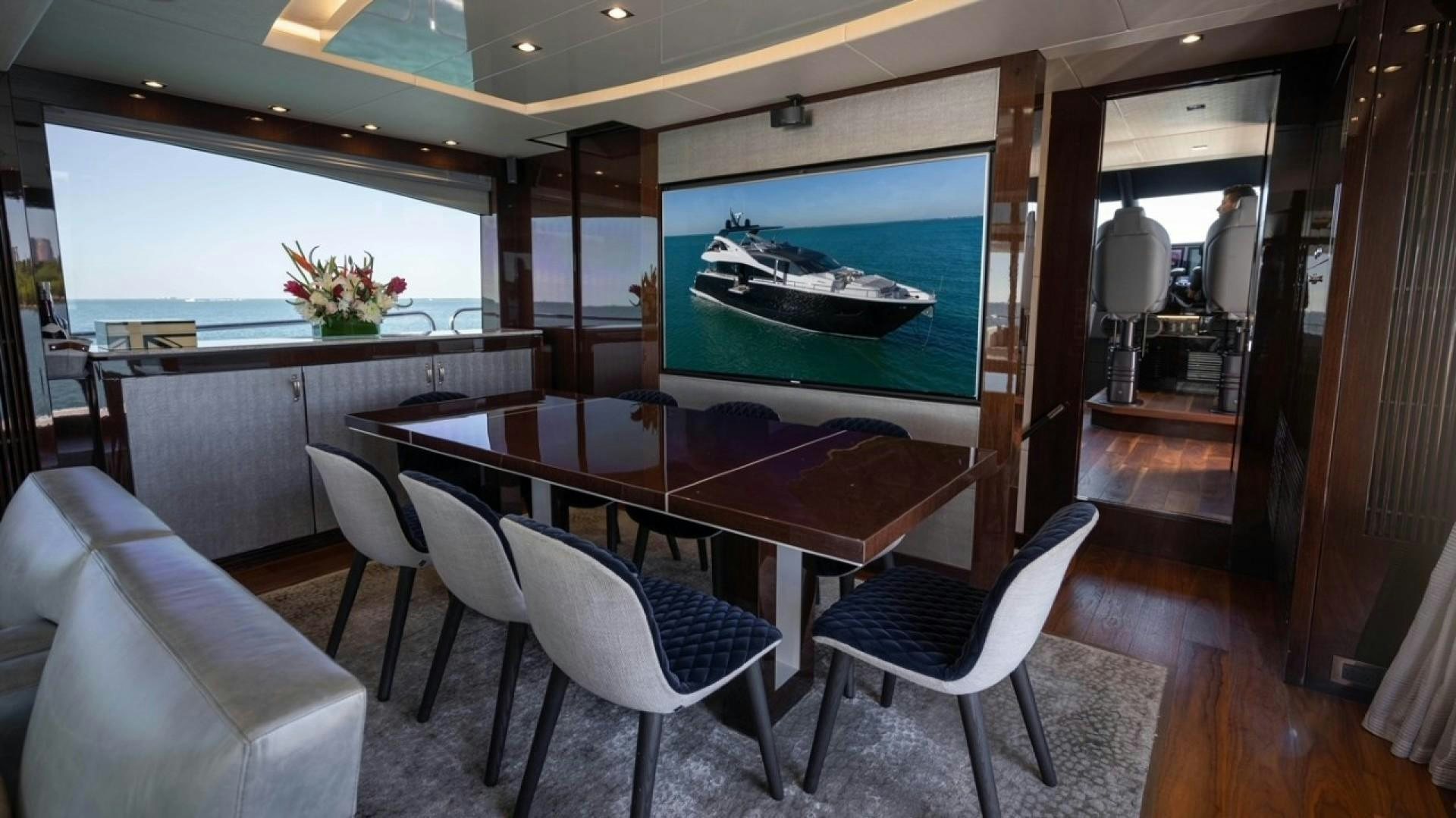 a room with a table and chairs aboard ENTERPRISE Yacht for Sale