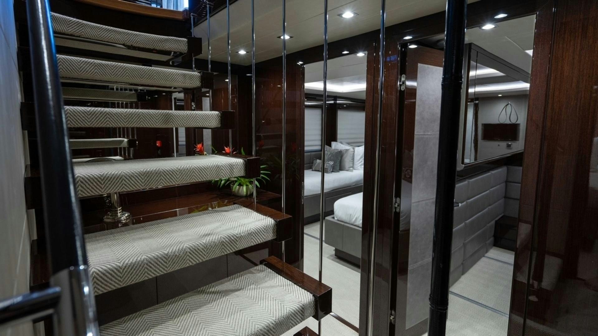 a room with a bed and a bench aboard ENTERPRISE Yacht for Sale