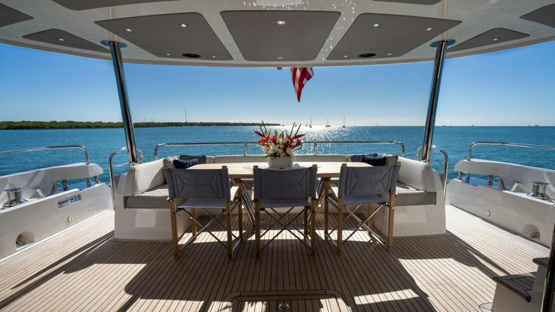 a table and chairs on a boat aboard ENTERPRISE Yacht for Sale