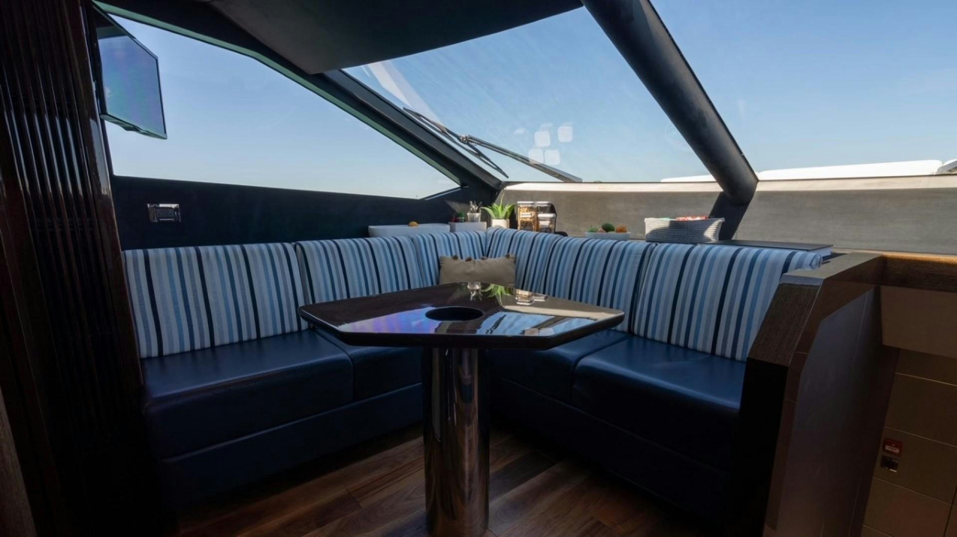 a room with a table and a couch aboard ENTERPRISE Yacht for Sale