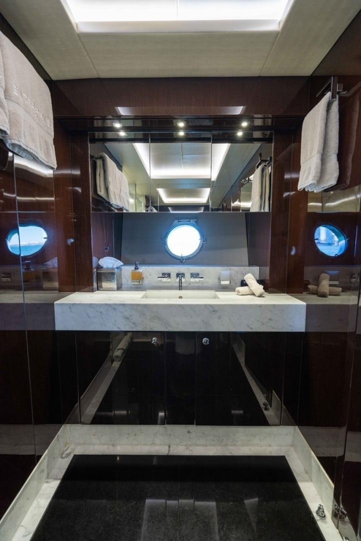 a bathroom with a large mirror aboard ENTERPRISE Yacht for Sale