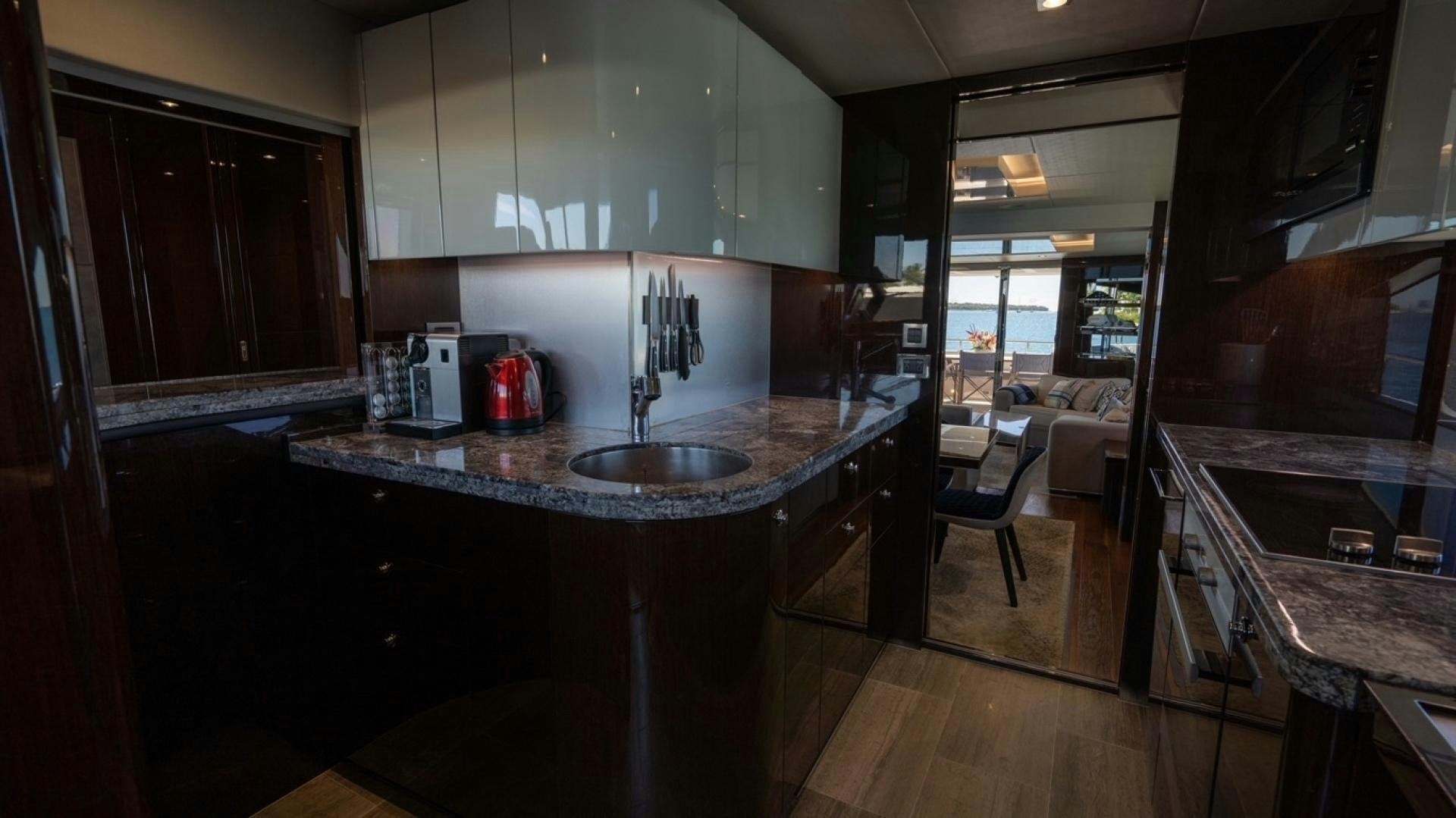 a kitchen with a sink and cabinets aboard ENTERPRISE Yacht for Sale