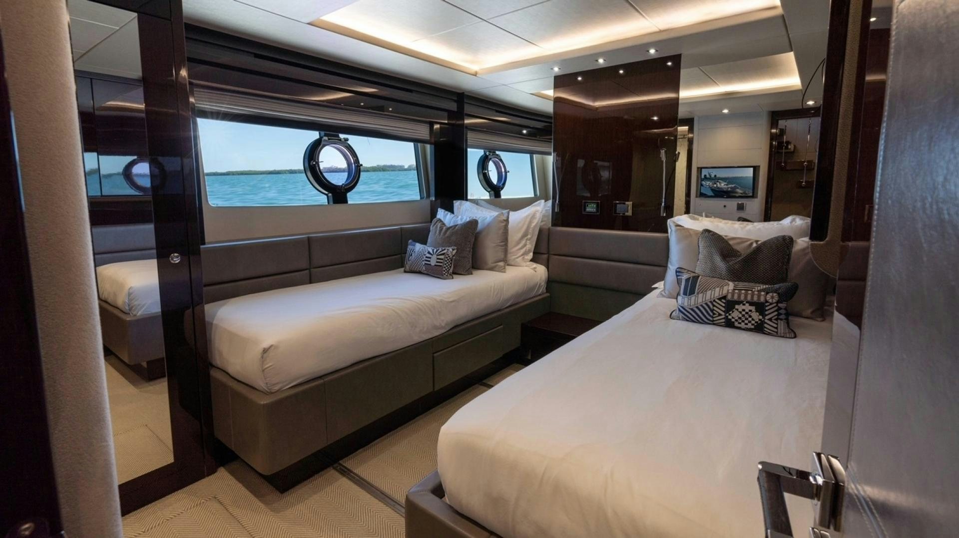a room with a bed and a window aboard ENTERPRISE Yacht for Sale