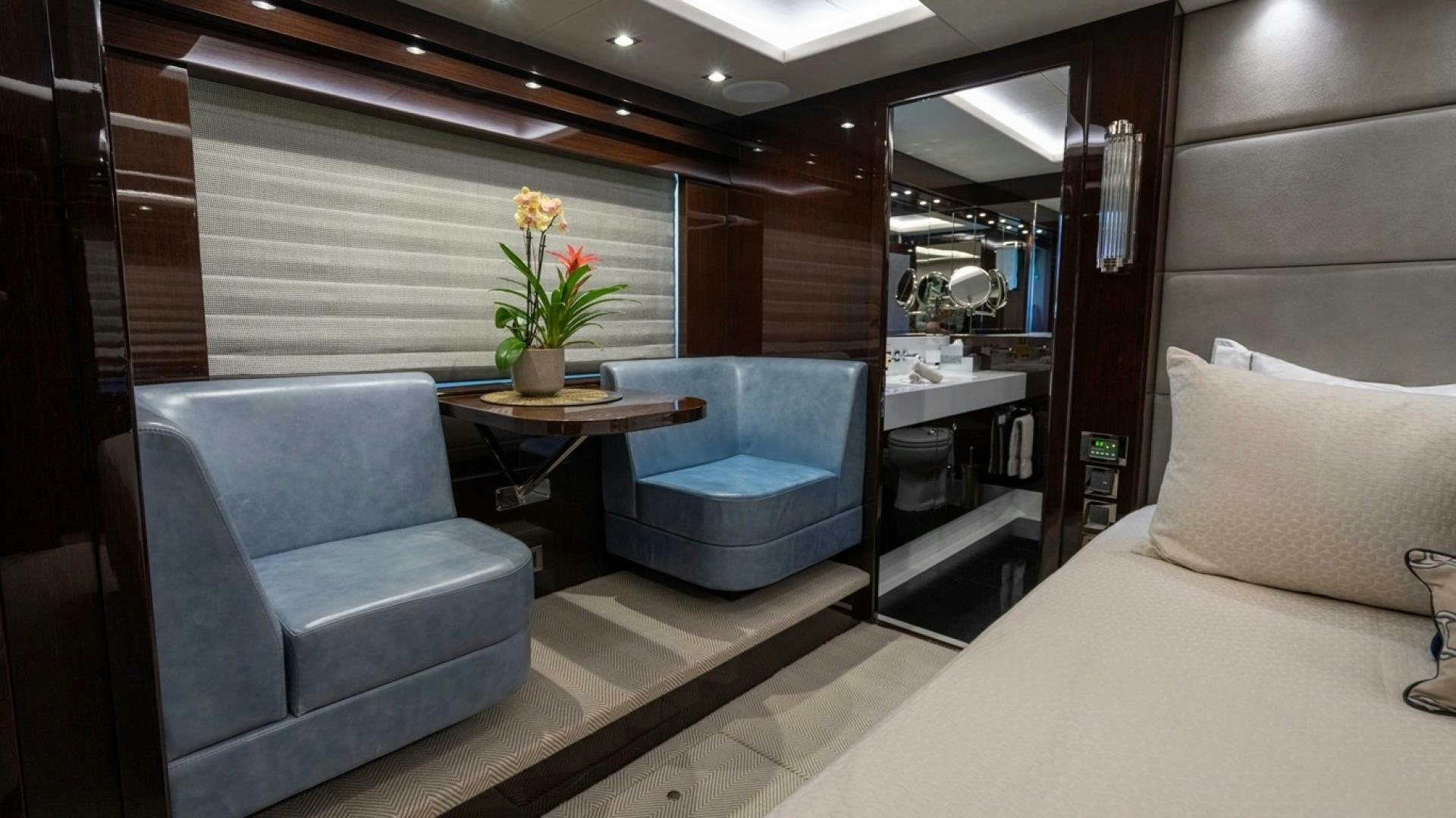 a room with a bed and a table aboard ENTERPRISE Yacht for Sale