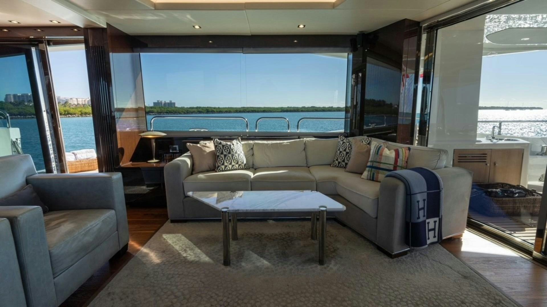 a living room with a large window aboard ENTERPRISE Yacht for Sale