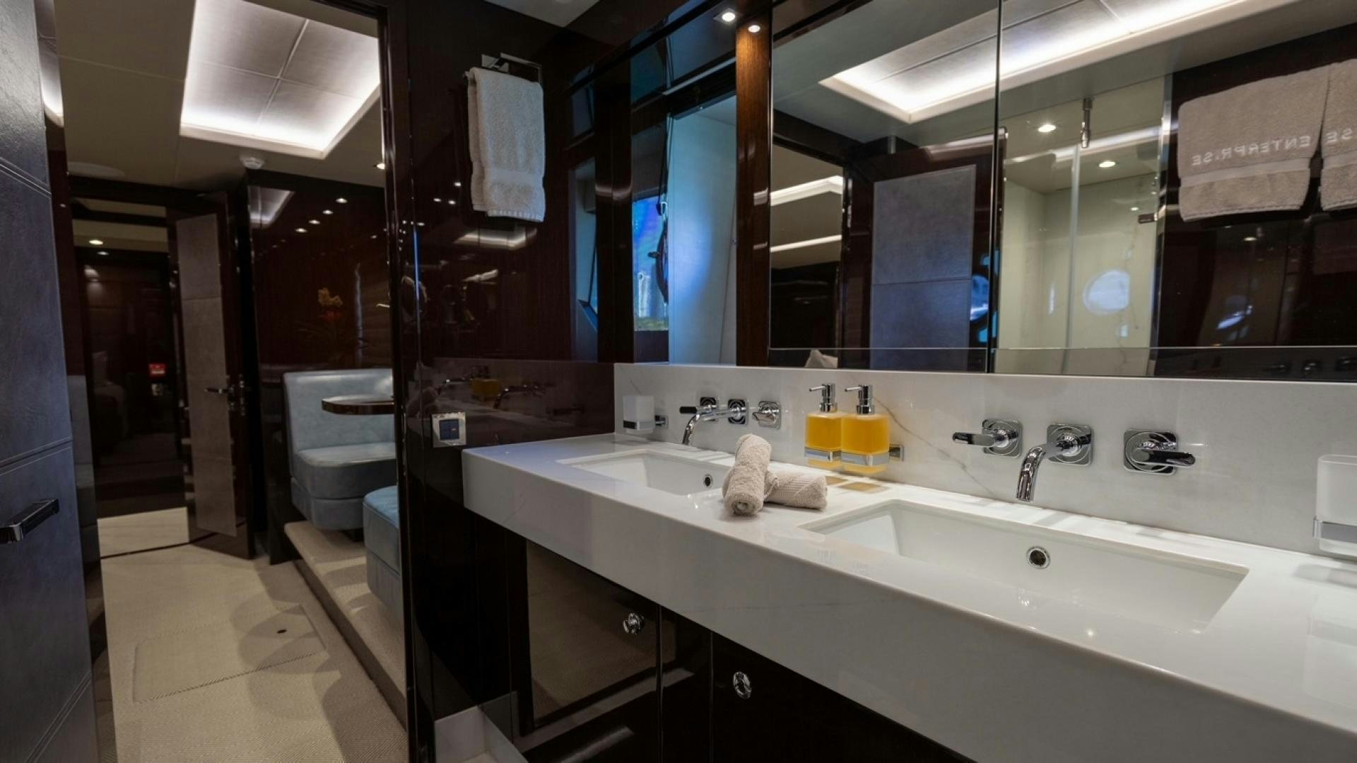 a bathroom with a large mirror aboard ENTERPRISE Yacht for Sale