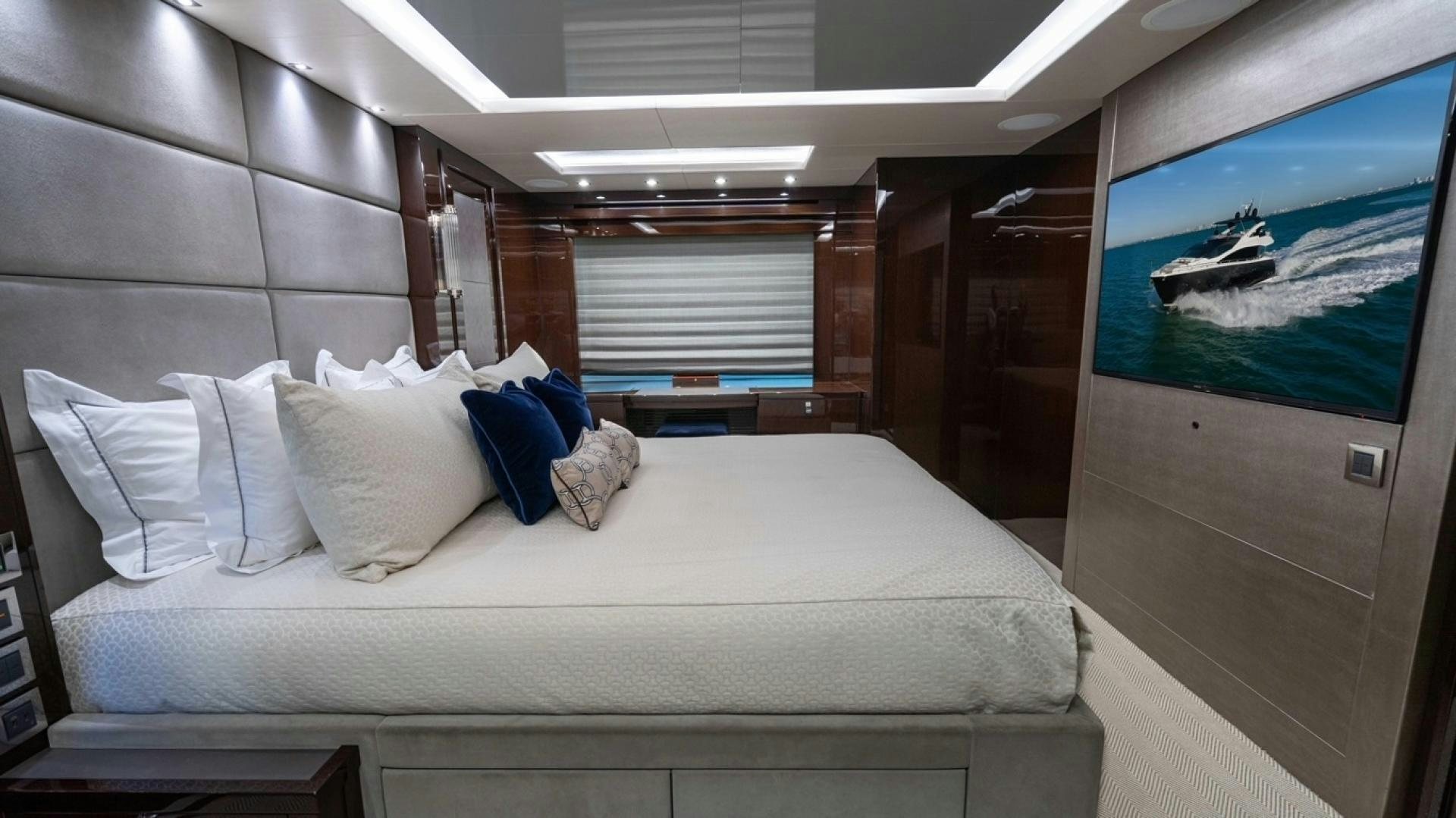 a bed with a large screen aboard ENTERPRISE Yacht for Sale