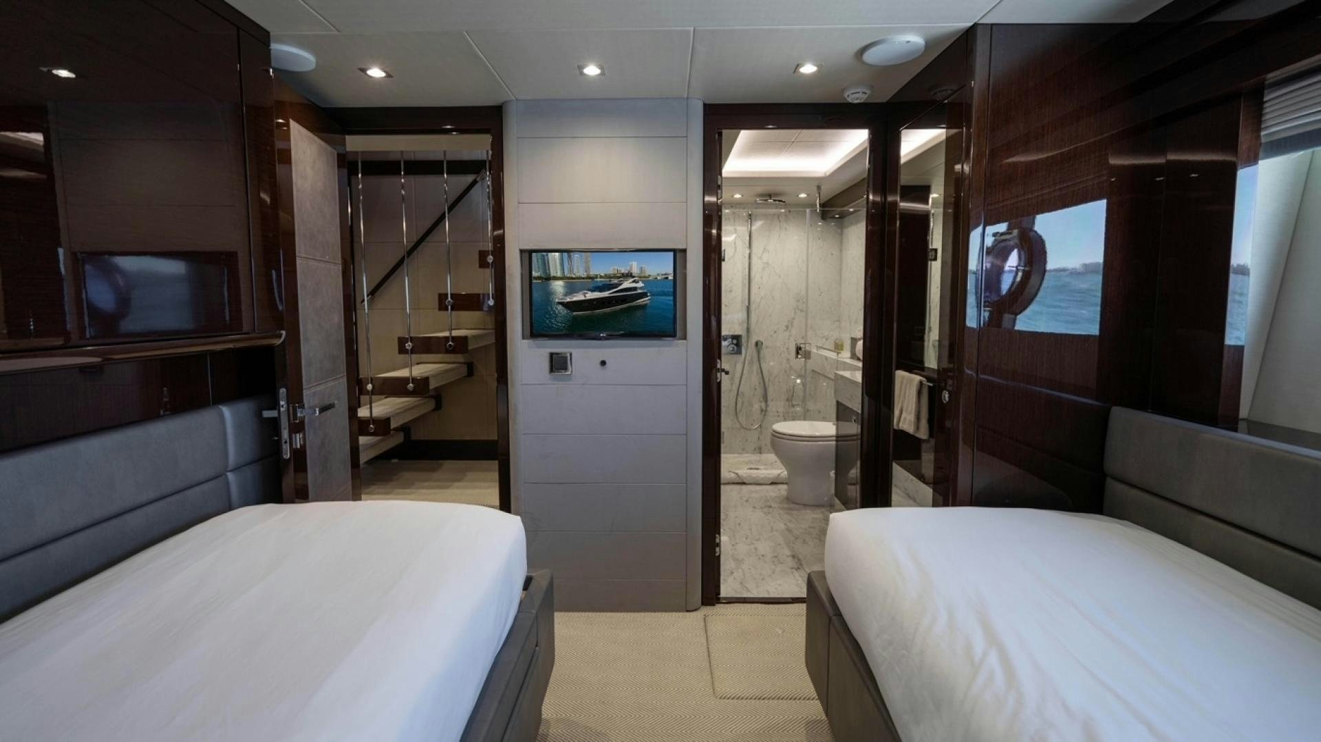 a room with a bed and a mirror aboard ENTERPRISE Yacht for Sale