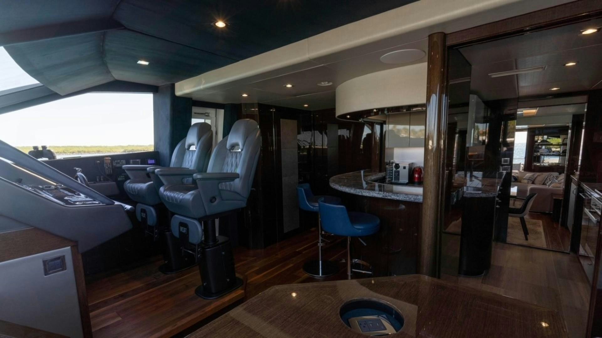 a room with a table and chairs aboard ENTERPRISE Yacht for Sale
