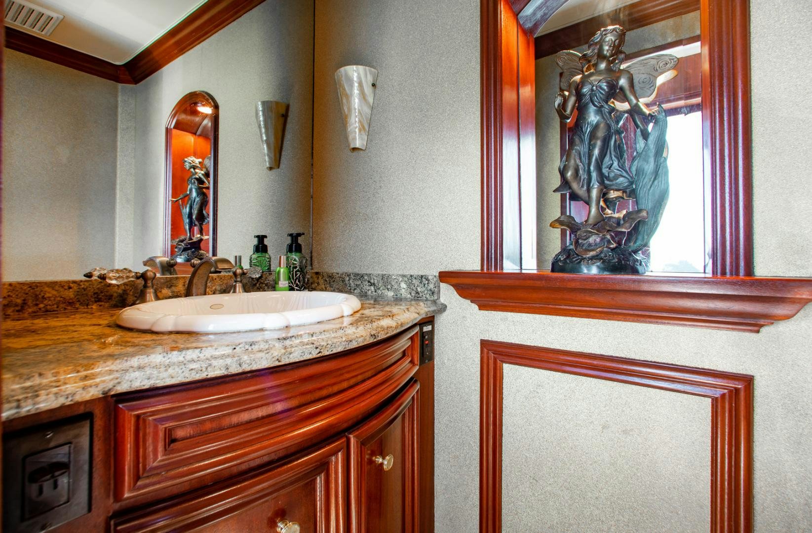 a bathroom with a large mirror aboard THREE KINGS Yacht for Sale
