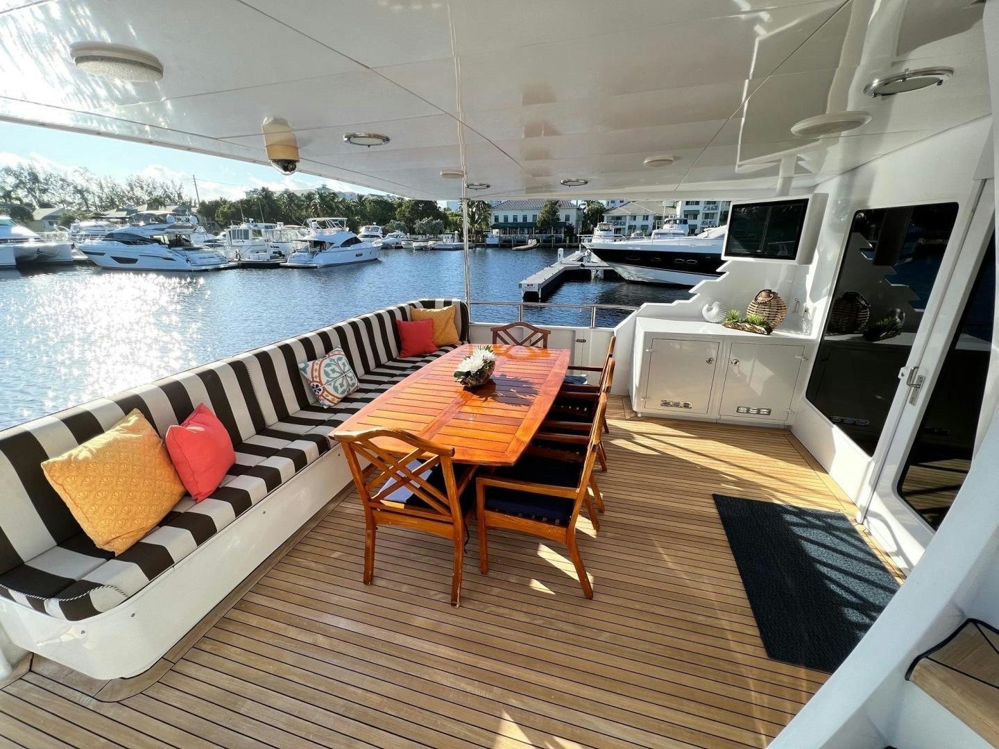 a table and chairs on a deck aboard THREE KINGS Yacht for Sale