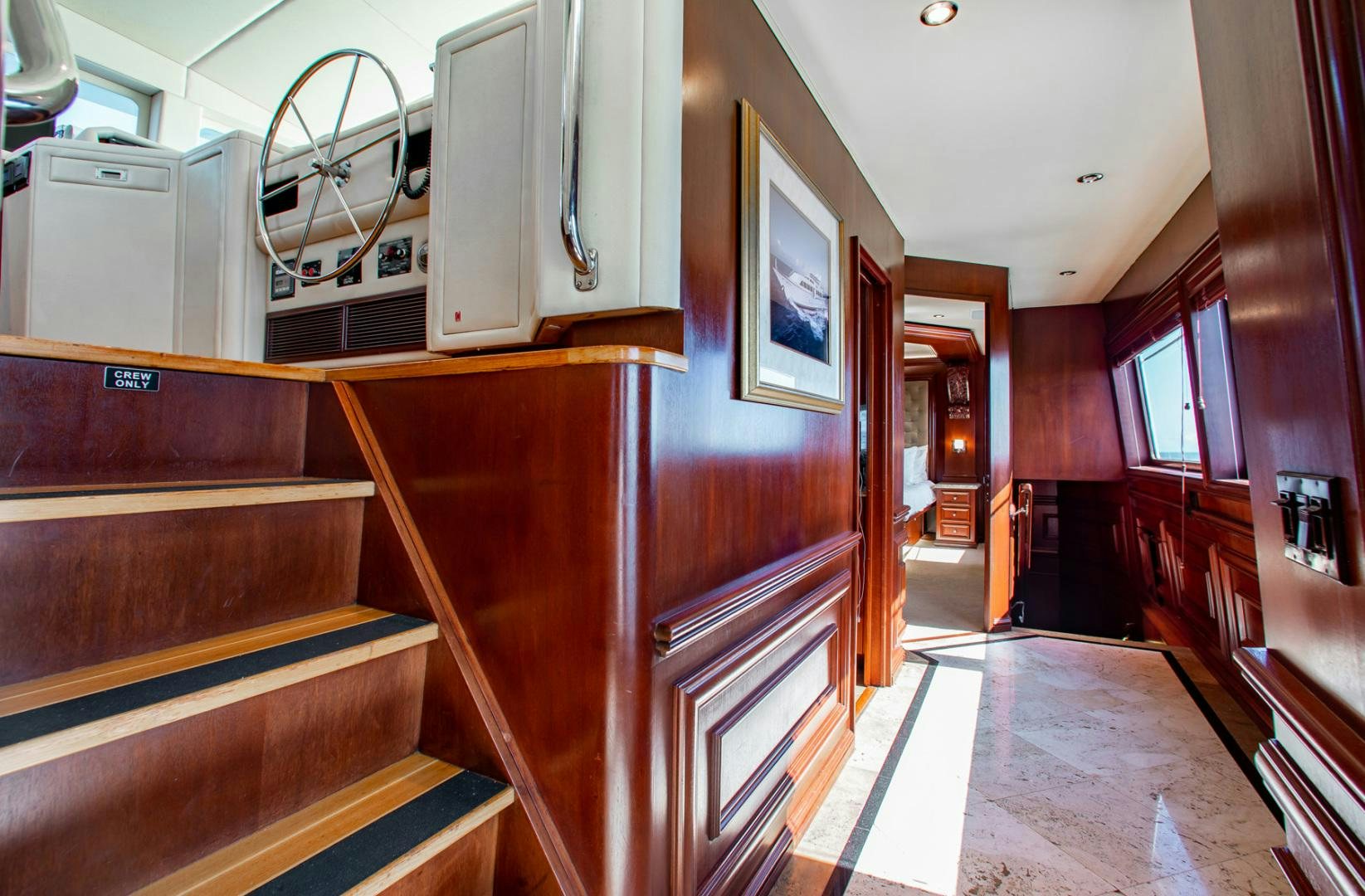 a room with wooden furniture aboard THREE KINGS Yacht for Sale
