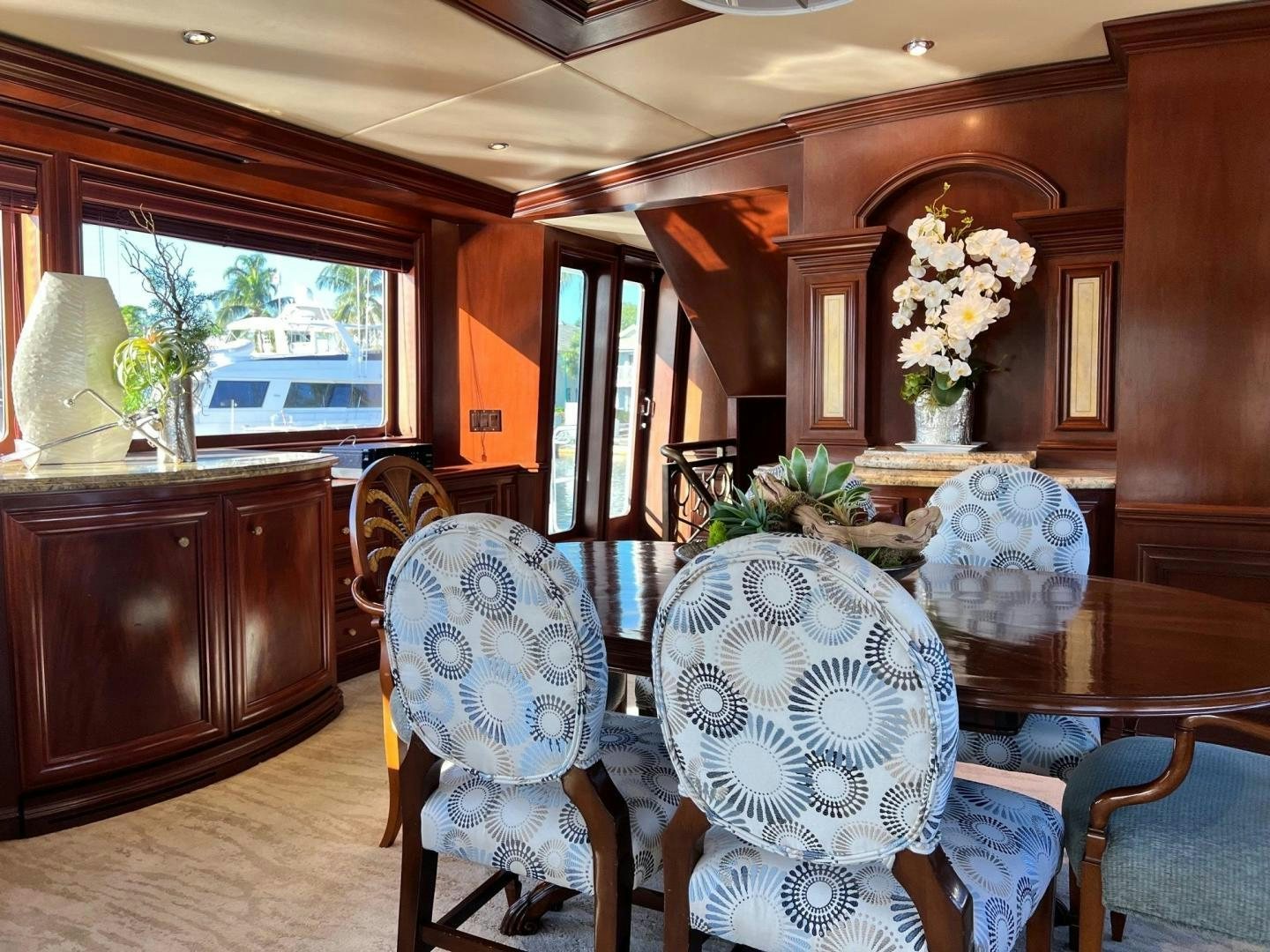 a dining room with a table and chairs aboard THREE KINGS Yacht for Sale