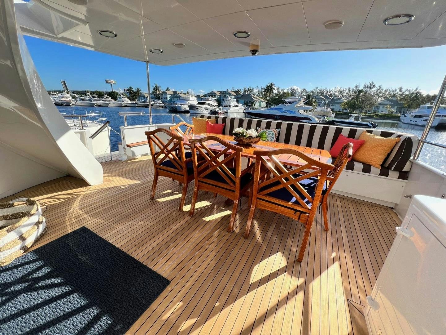 a room with a table and chairs aboard THREE KINGS Yacht for Sale