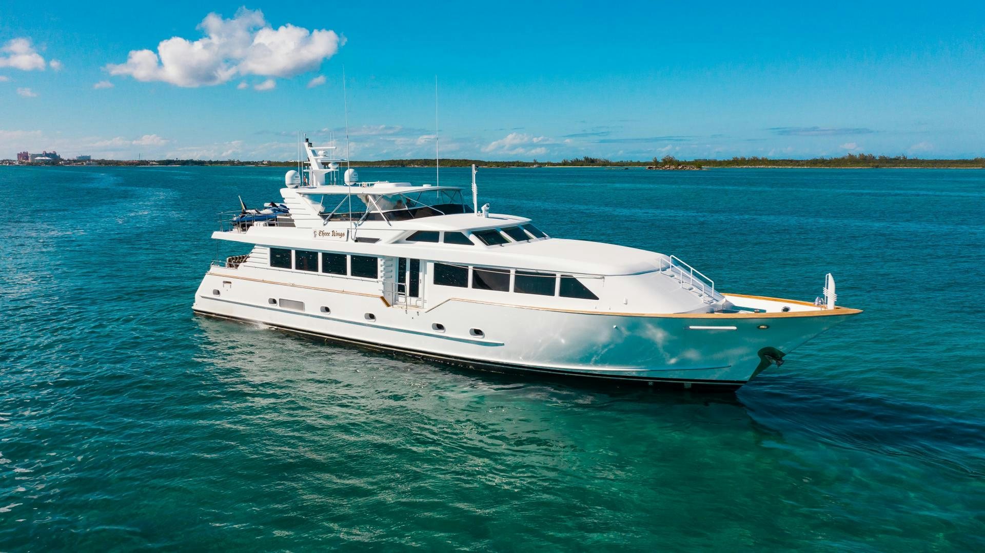 a white boat on the water aboard THREE KINGS Yacht for Sale