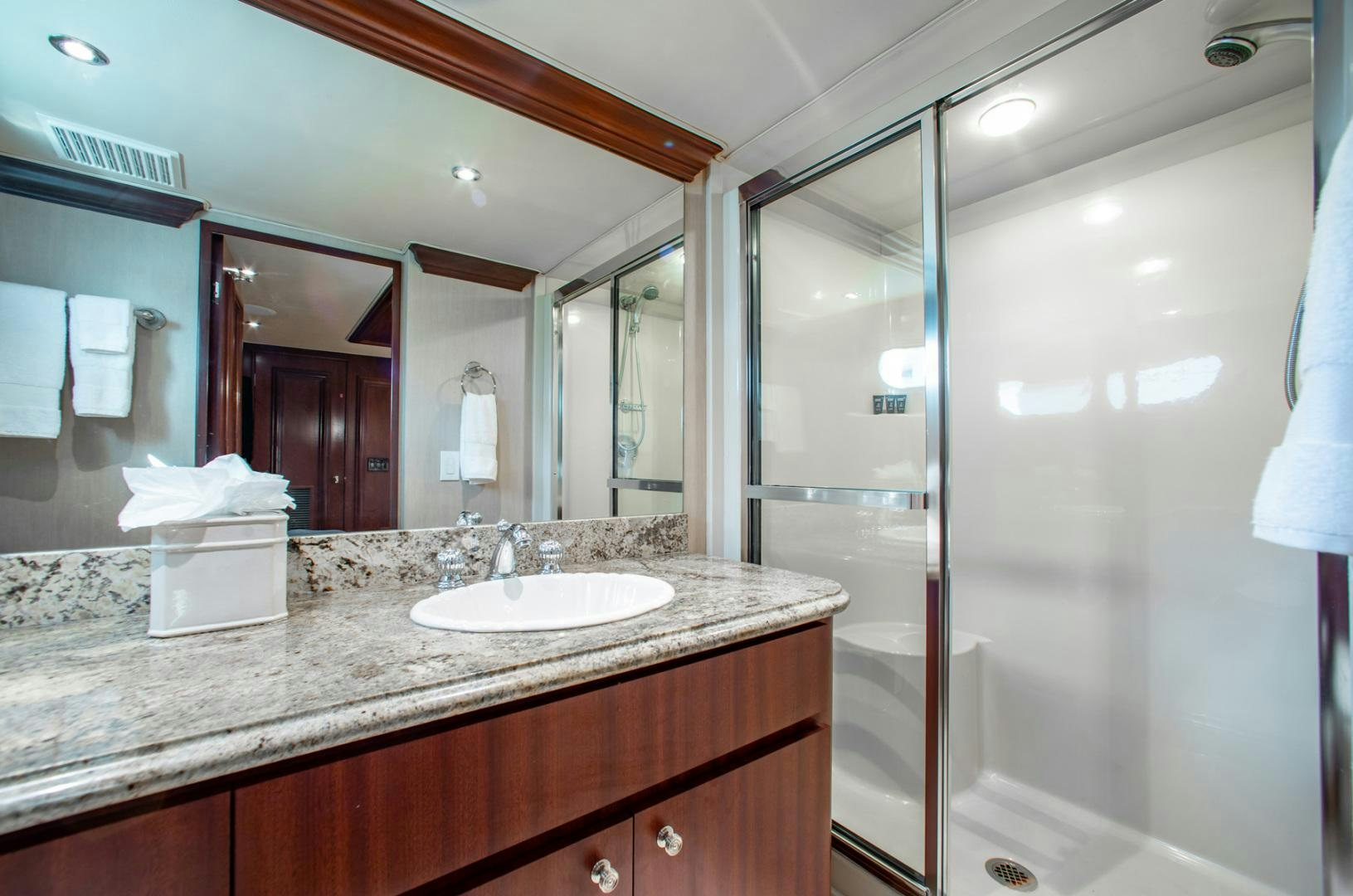 a bathroom with a large mirror aboard THREE KINGS Yacht for Sale