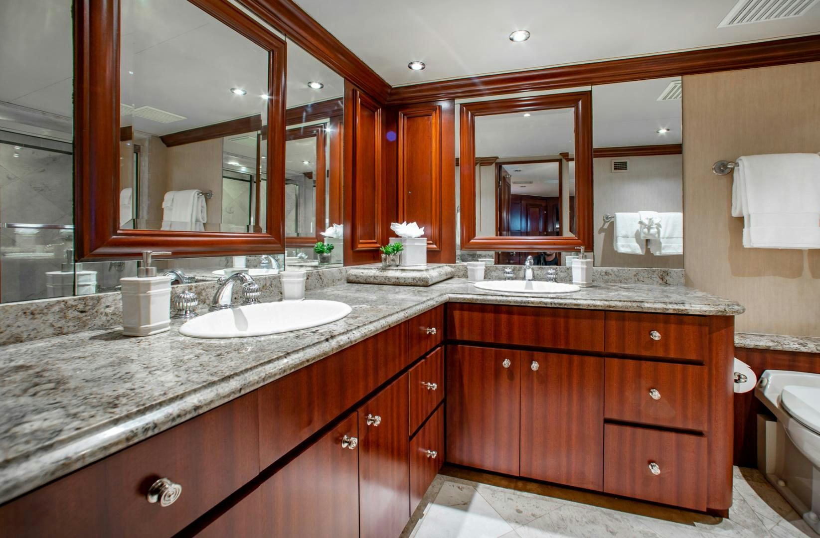 a bathroom with a large mirror aboard THREE KINGS Yacht for Sale