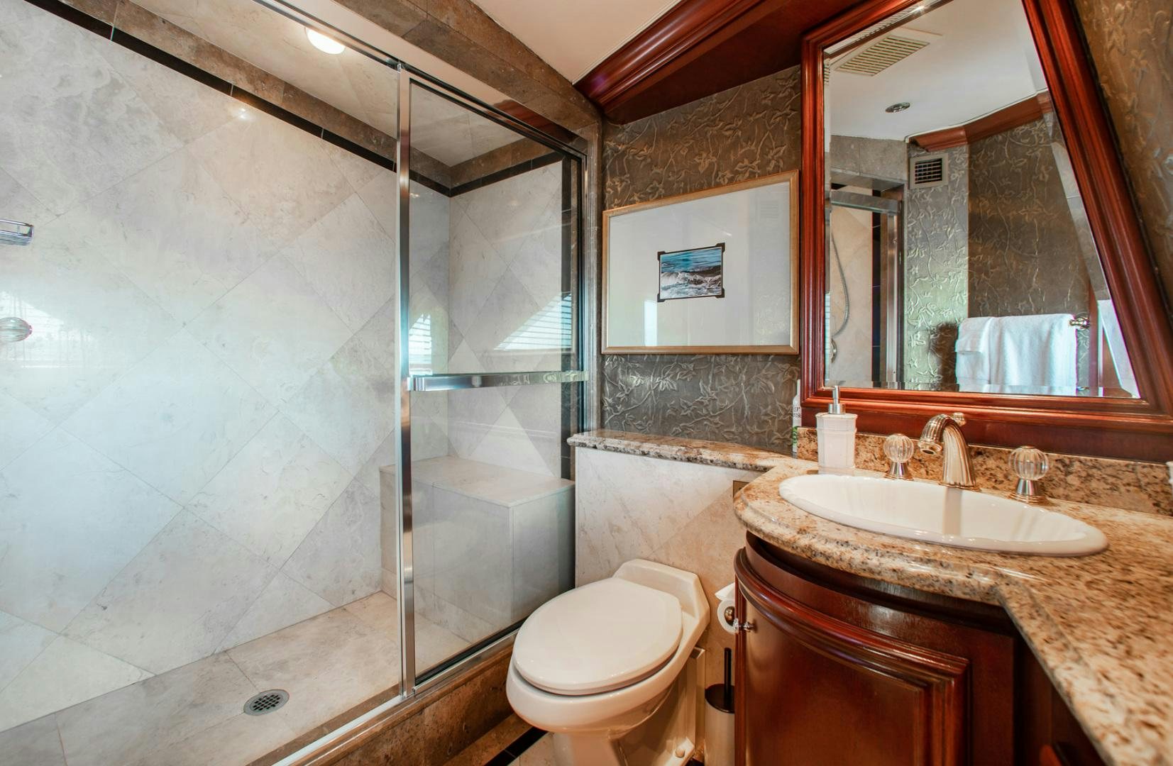 a bathroom with a glass shower aboard THREE KINGS Yacht for Sale