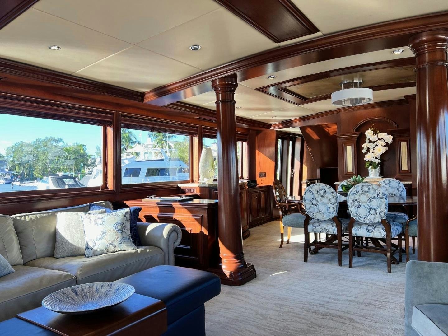 a living room with a couch and a table aboard THREE KINGS Yacht for Sale