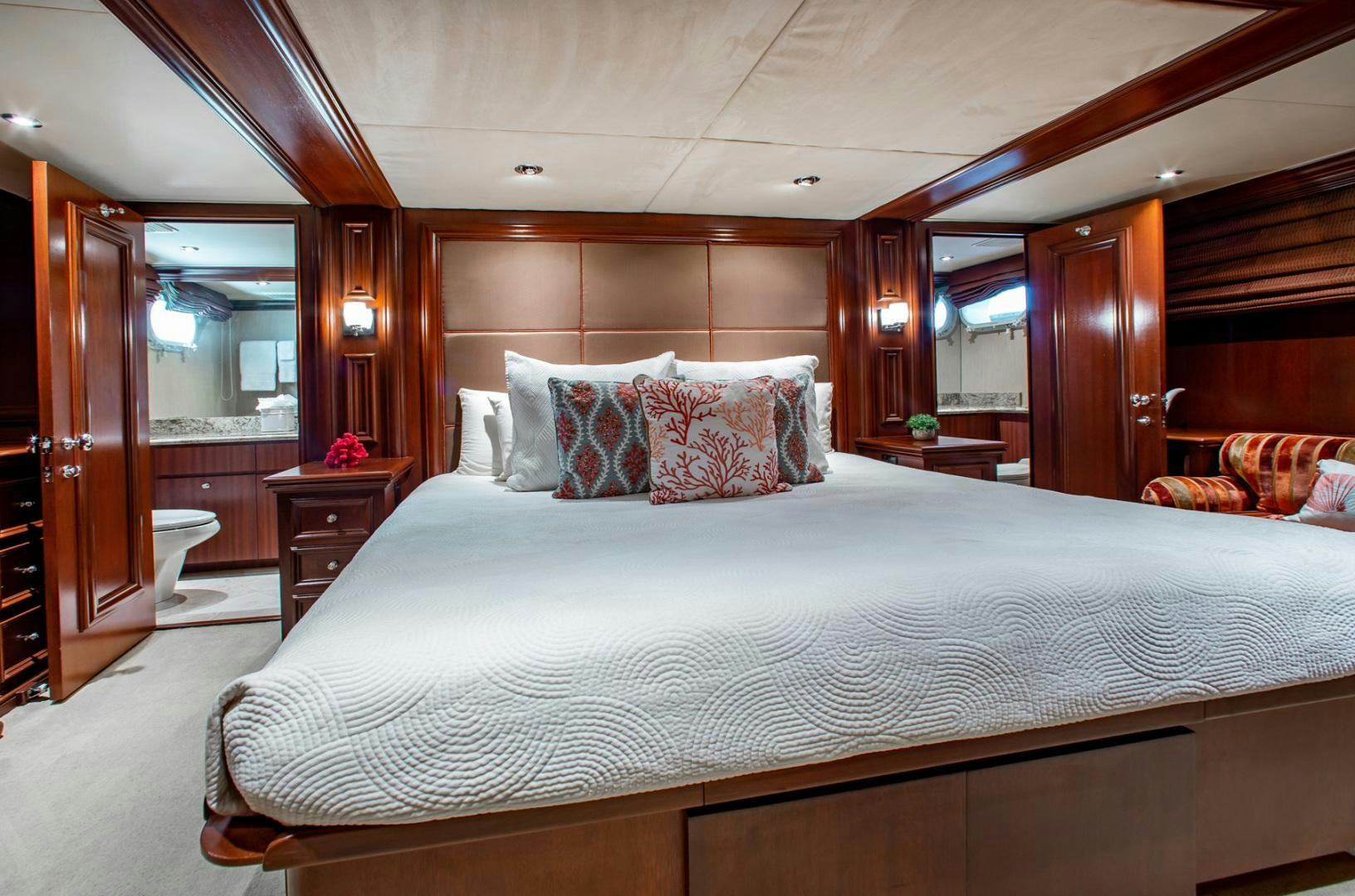 a bed with a white comforter aboard THREE KINGS Yacht for Sale
