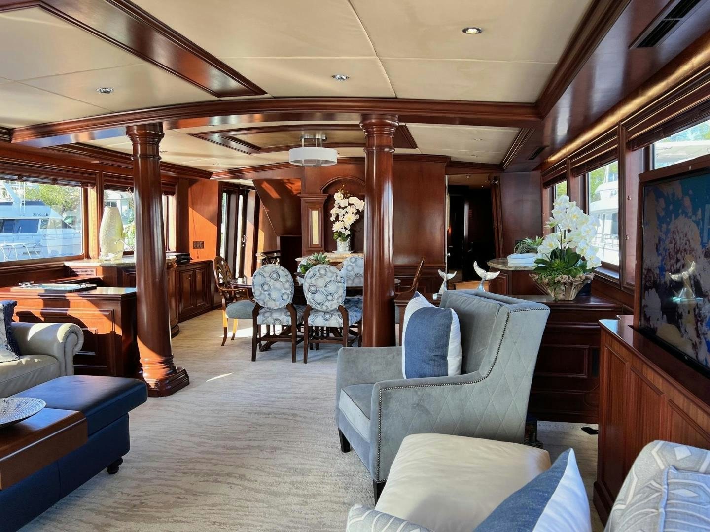a room with a couch and chairs aboard THREE KINGS Yacht for Sale