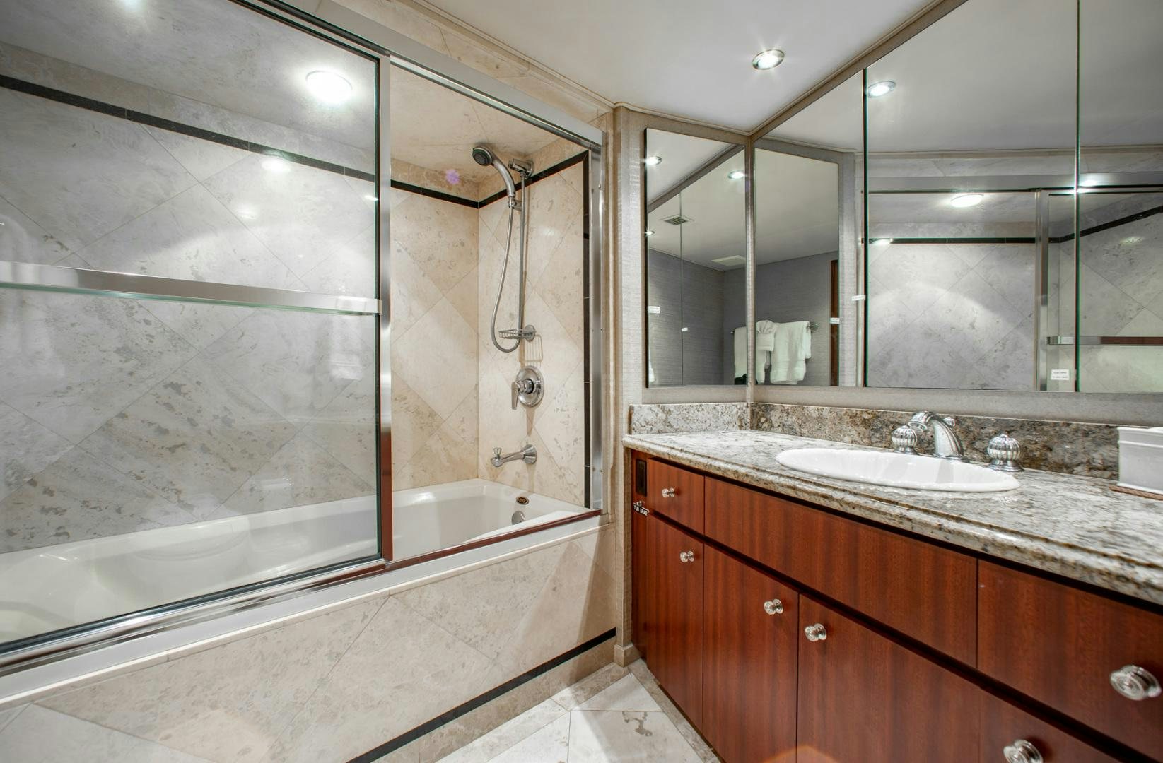 a bathroom with a bathtub and sink aboard THREE KINGS Yacht for Sale