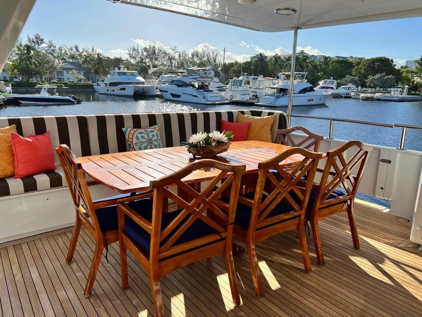 a table and chairs on a deck aboard THREE KINGS Yacht for Sale