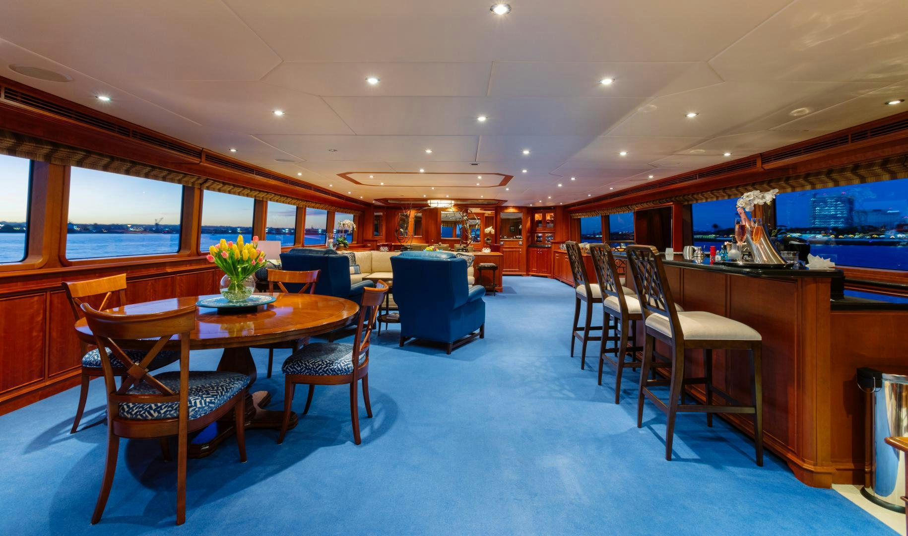 a room with a table chairs and a window aboard APHRODITE Yacht for Sale