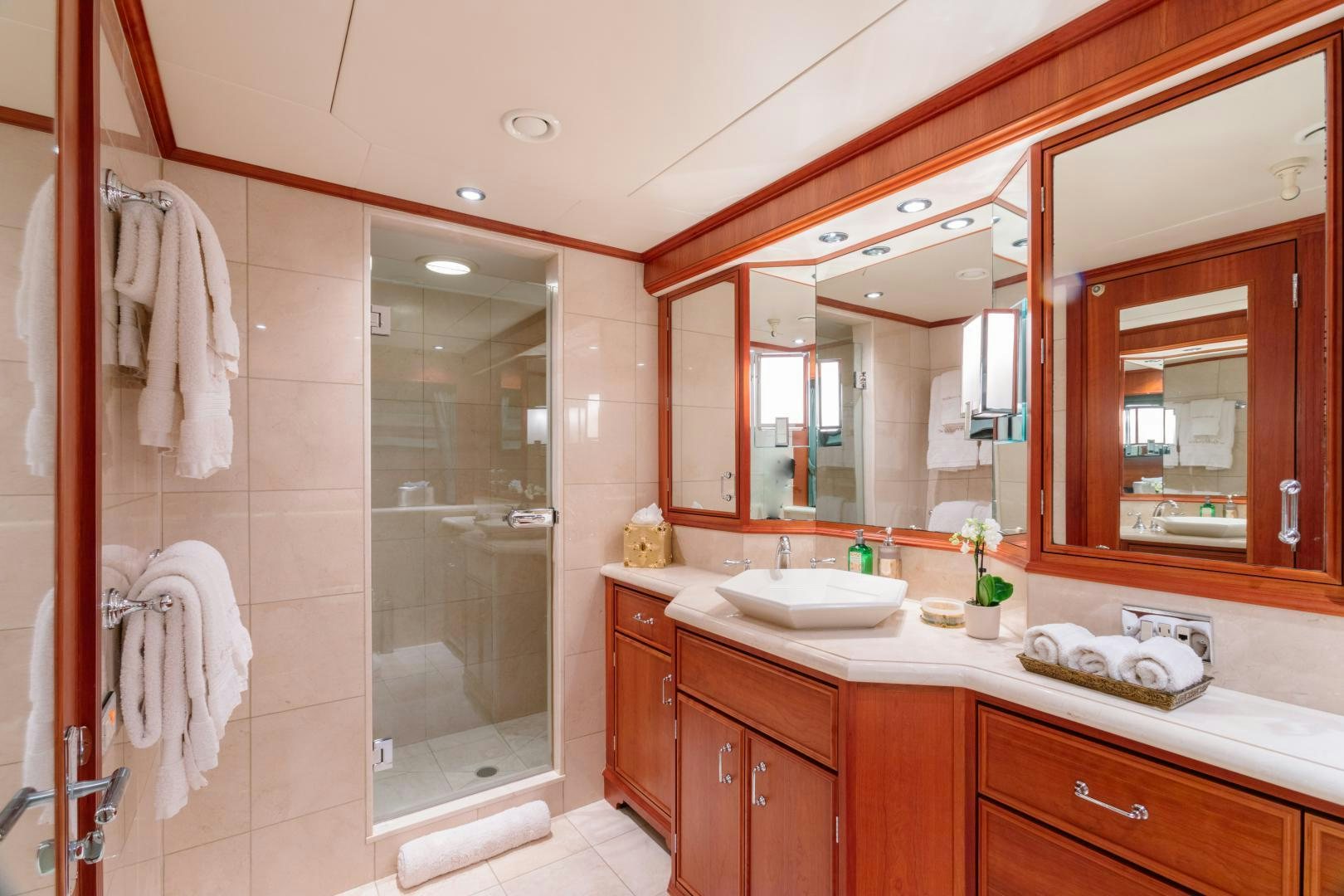 a bathroom with a large mirror aboard APHRODITE Yacht for Sale