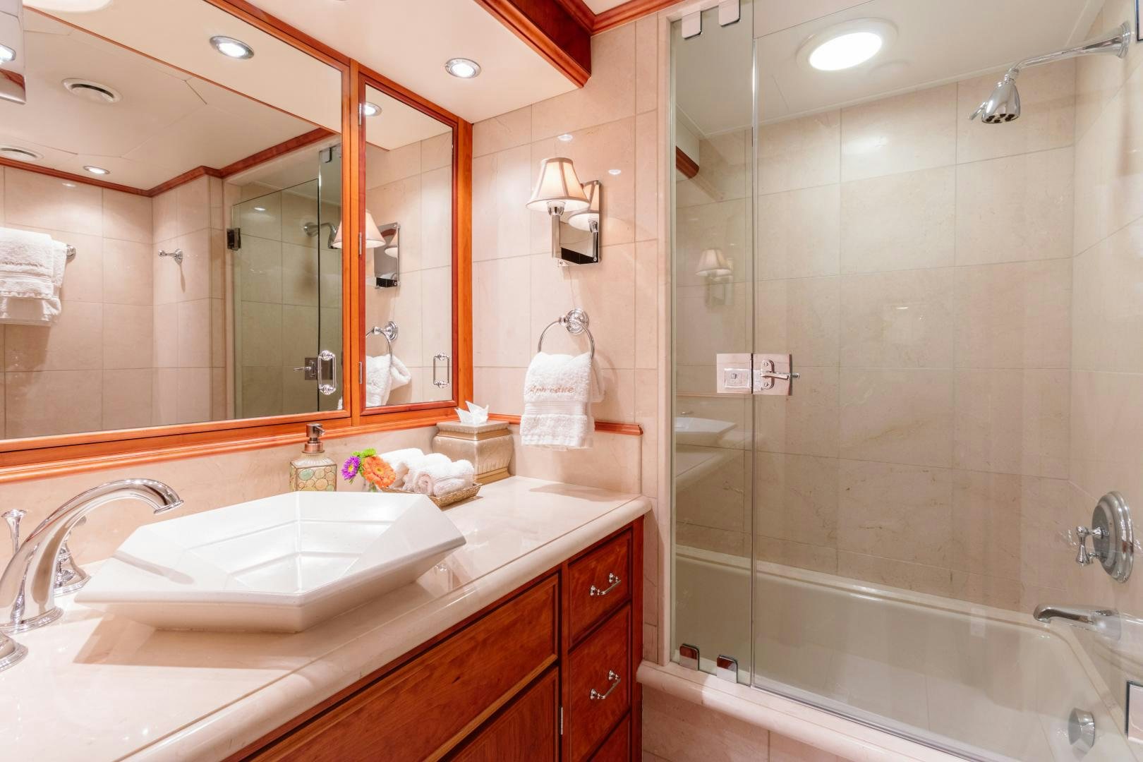 a bathroom with a glass shower aboard APHRODITE Yacht for Sale