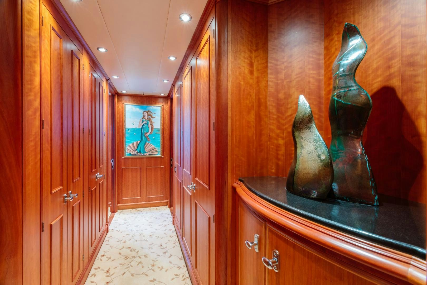 a room with wood cabinets and a wood door aboard APHRODITE Yacht for Sale