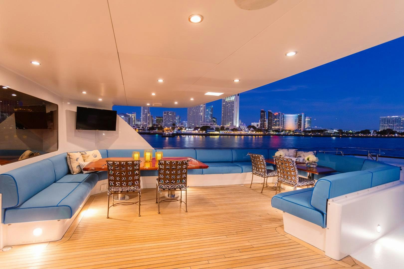 a large living room with a large pool and a city aboard APHRODITE Yacht for Sale