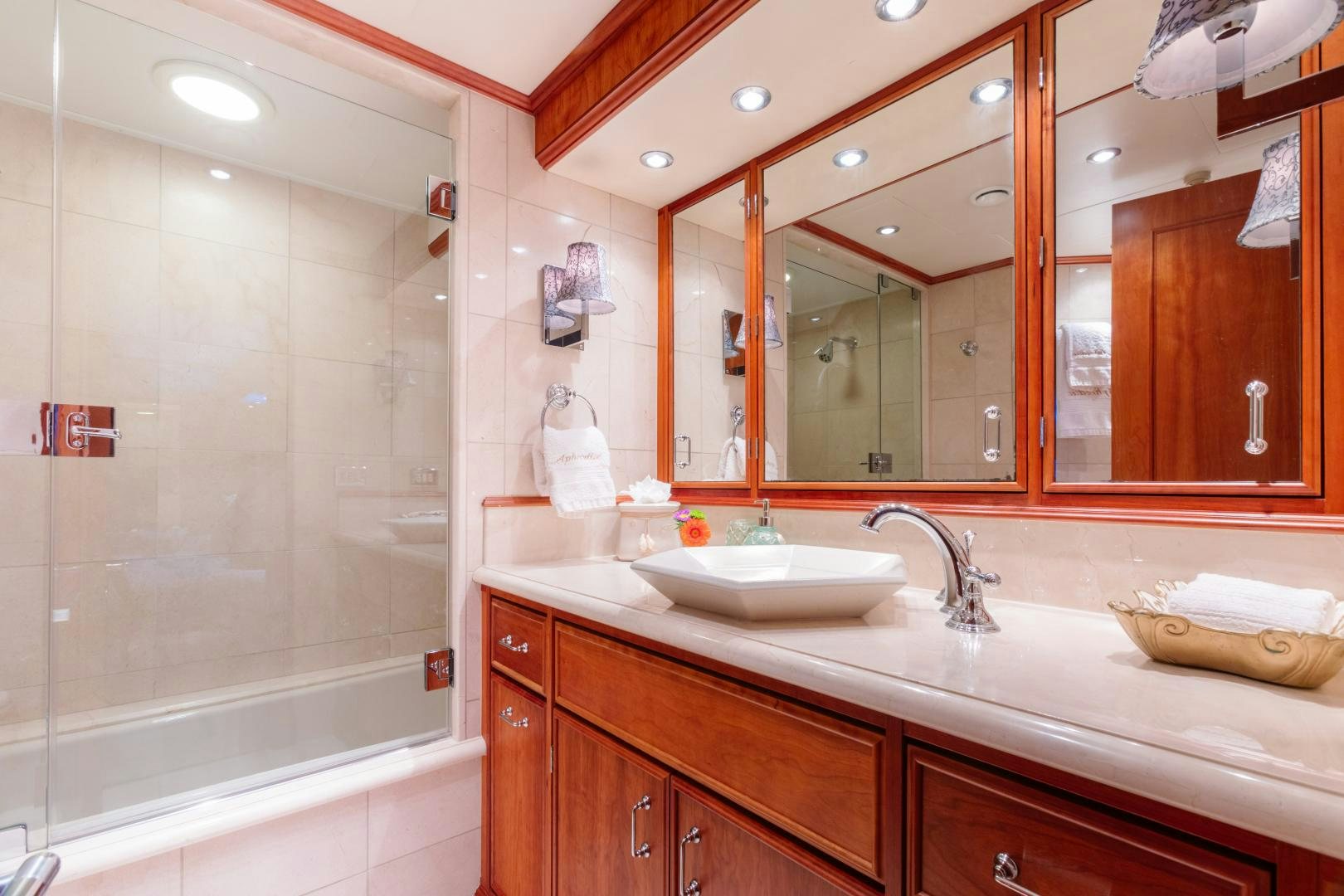 a bathroom with a large mirror aboard APHRODITE Yacht for Sale