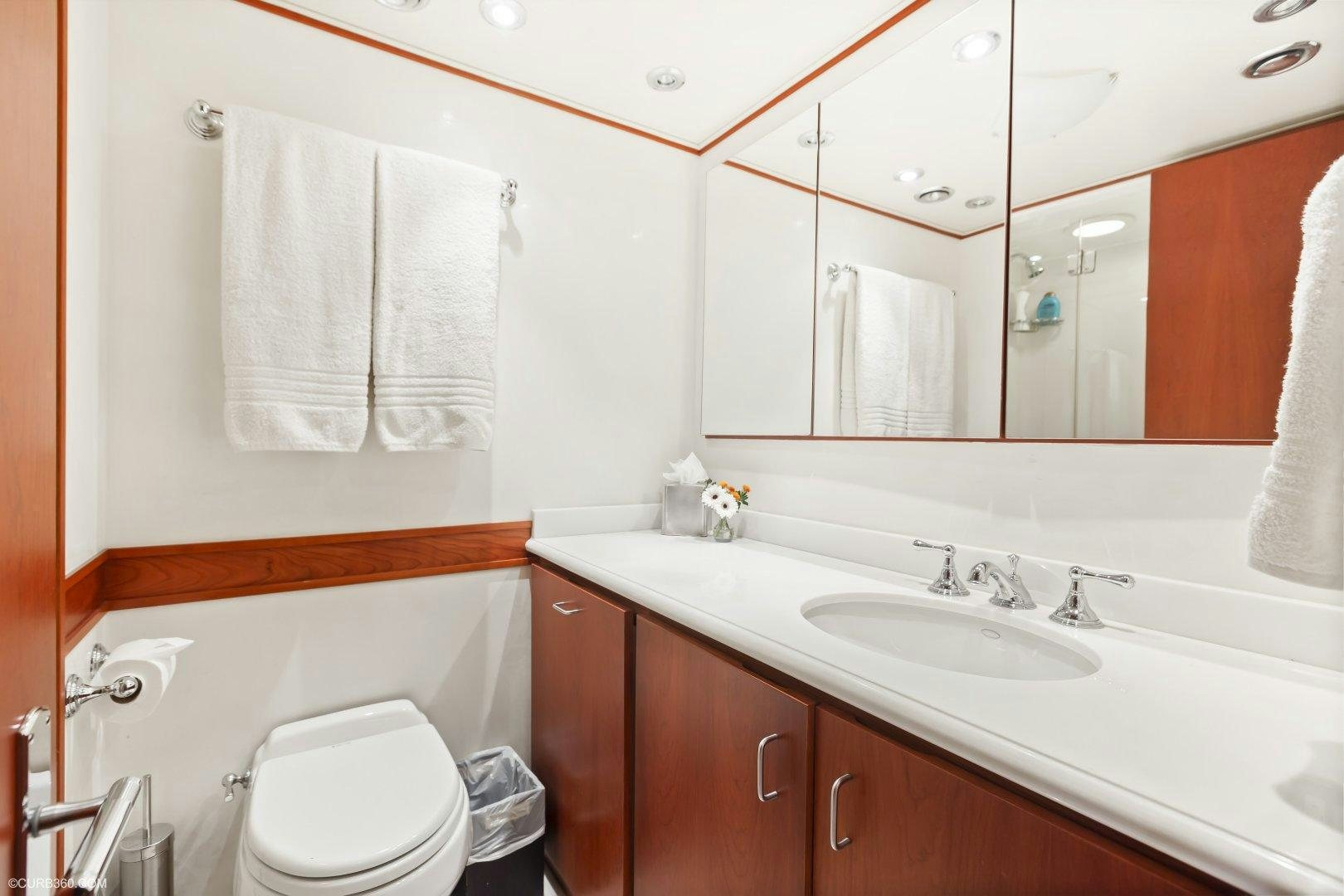 a bathroom with a sink and a toilet aboard APHRODITE Yacht for Sale