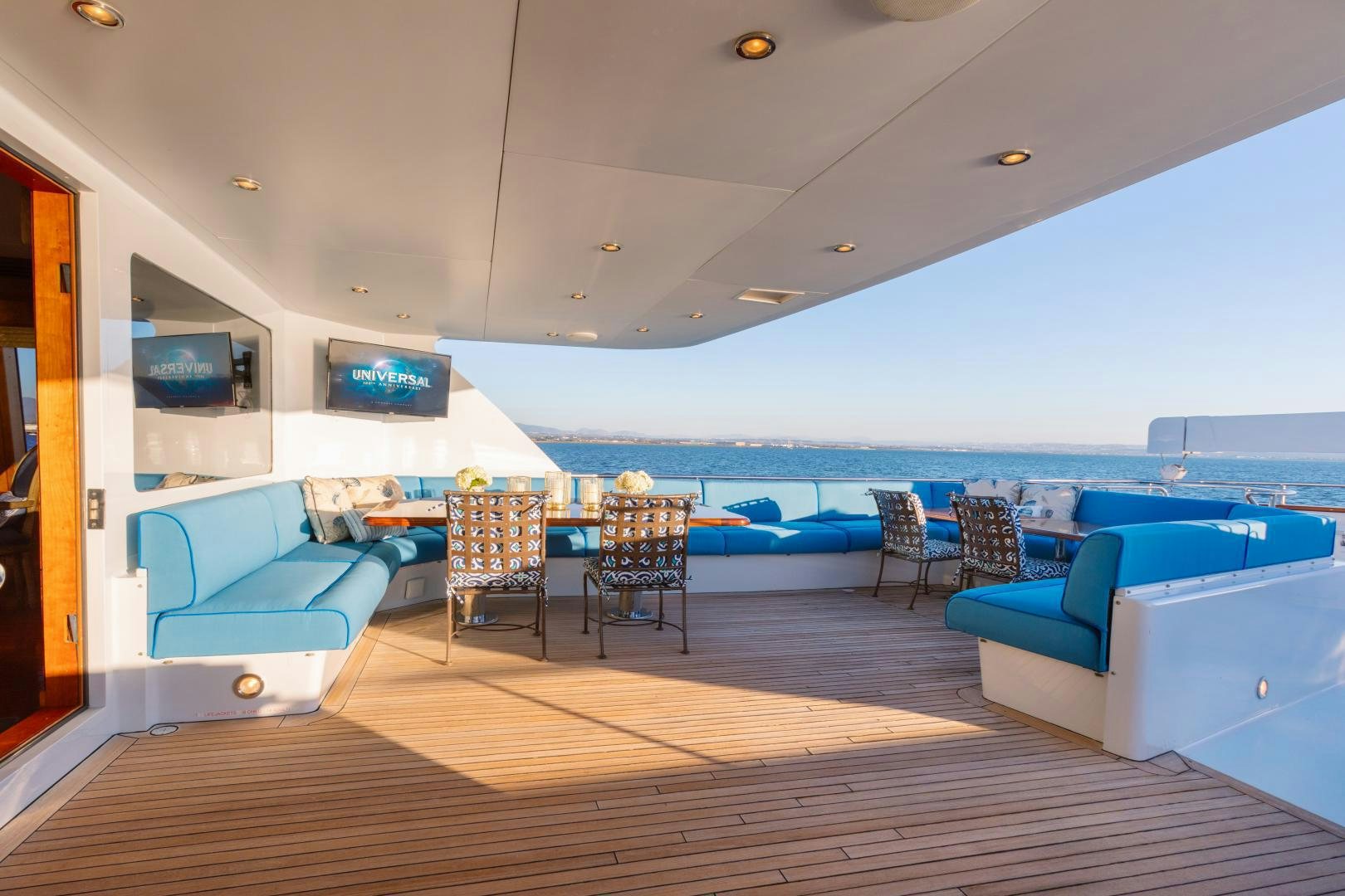 a room with a pool table and chairs aboard APHRODITE Yacht for Sale