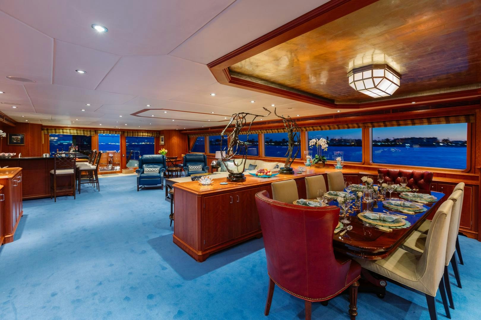 a room with tables and chairs aboard APHRODITE Yacht for Sale