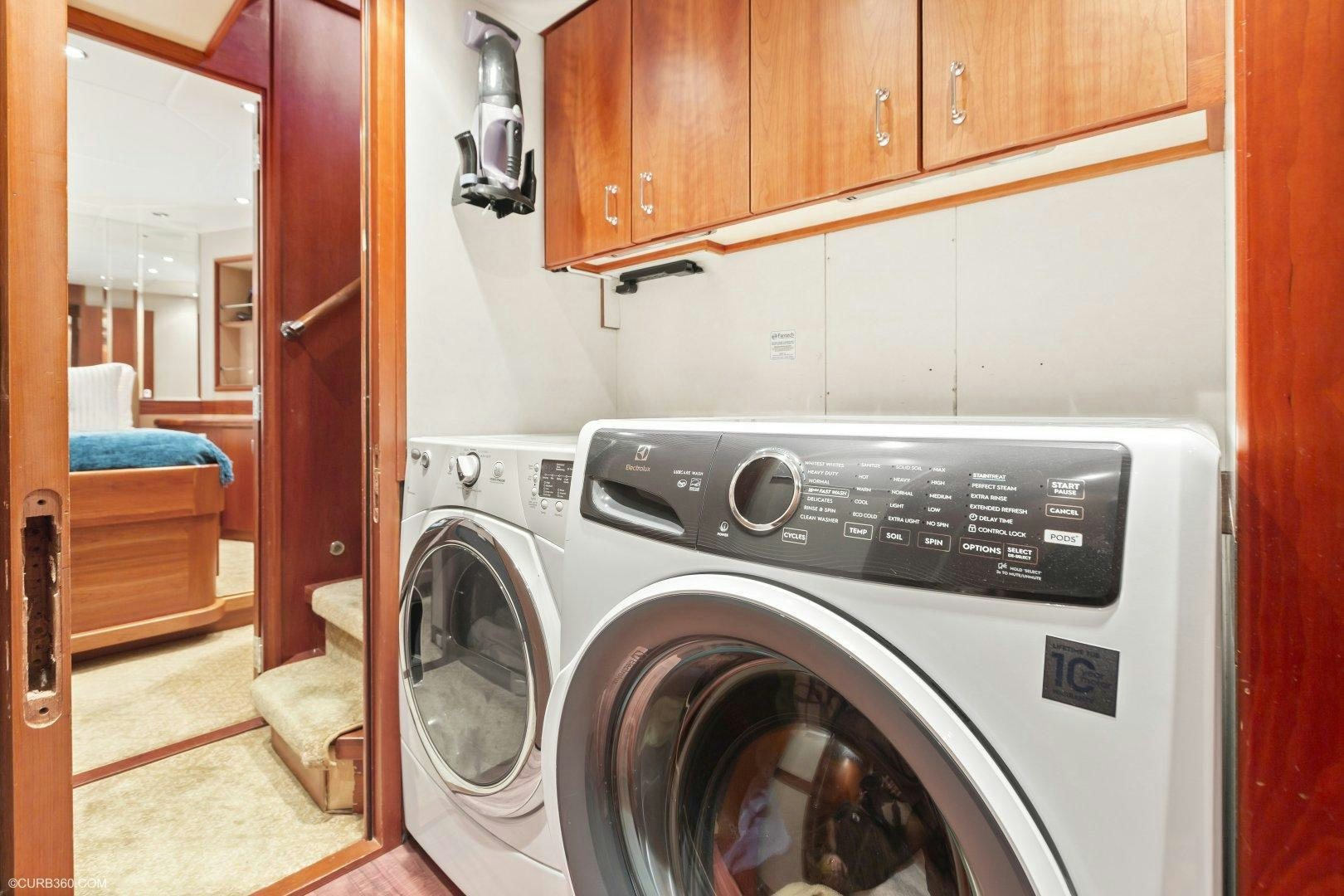 a washing machine in a room aboard APHRODITE Yacht for Sale