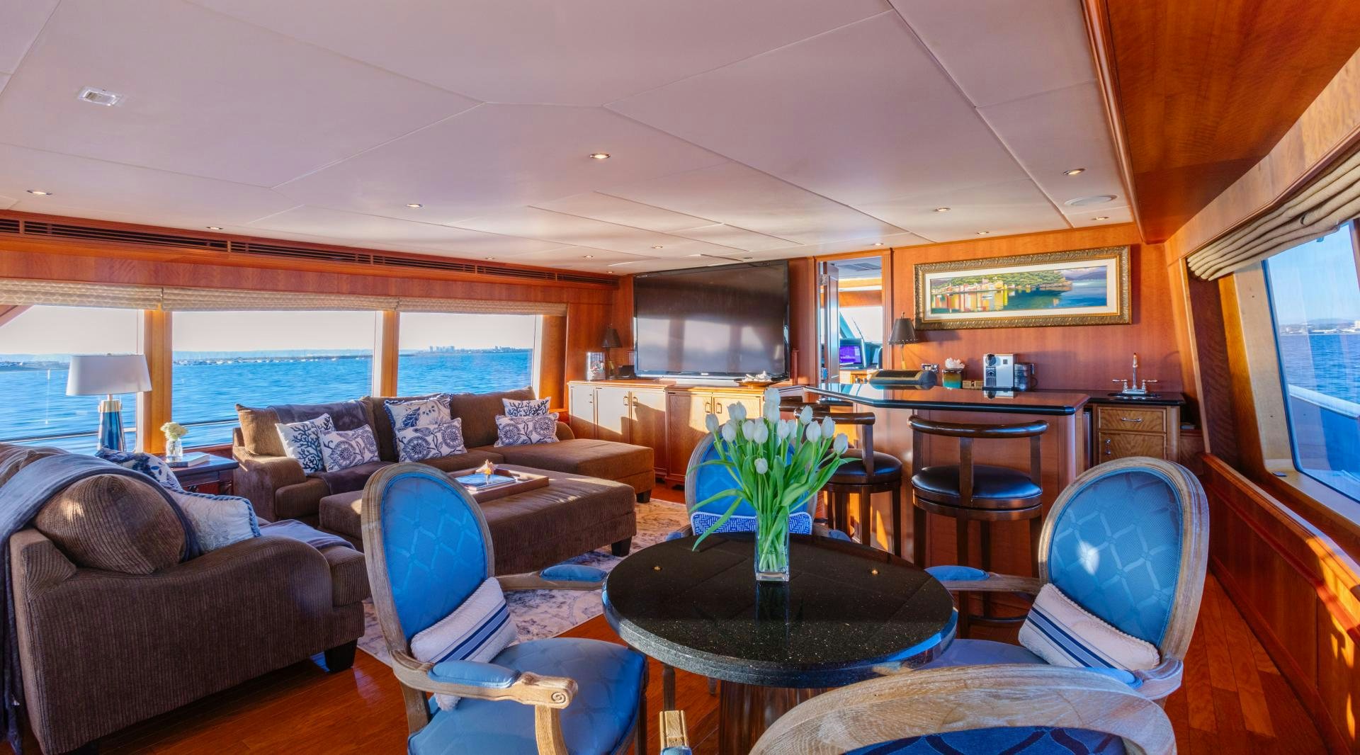 a living room with a couch and a table aboard APHRODITE Yacht for Sale