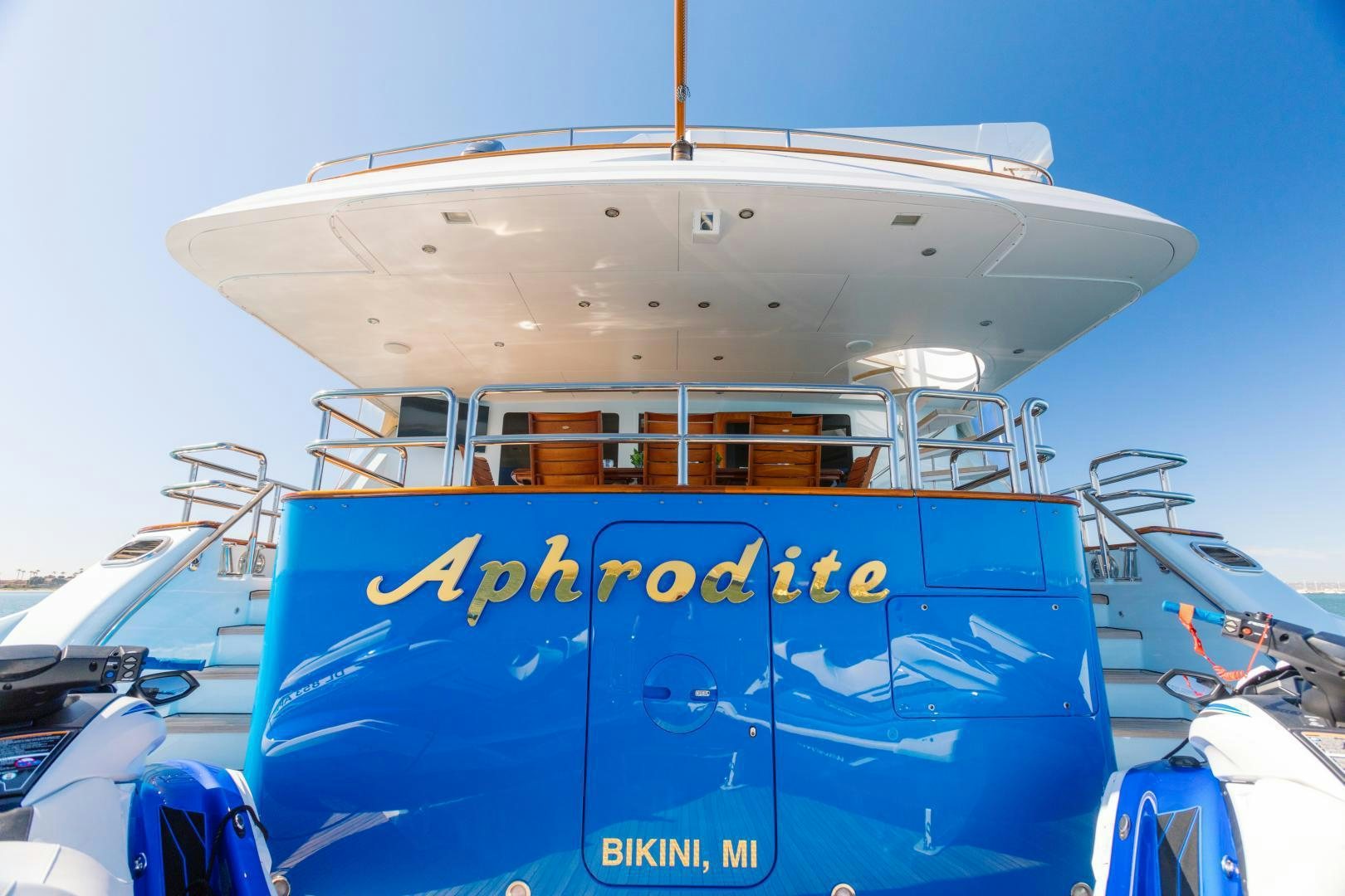 a large white boat with blue lettering aboard APHRODITE Yacht for Sale