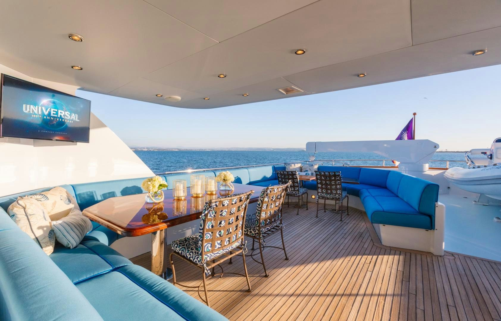 a boat with a table and chairs aboard APHRODITE Yacht for Sale